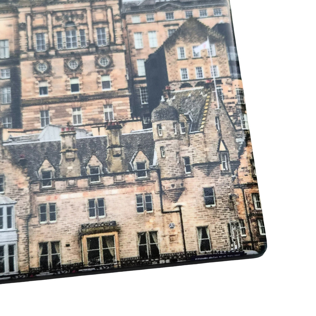 A close up of a tile coaster featuring a picture of Edinburgh's Old Town.