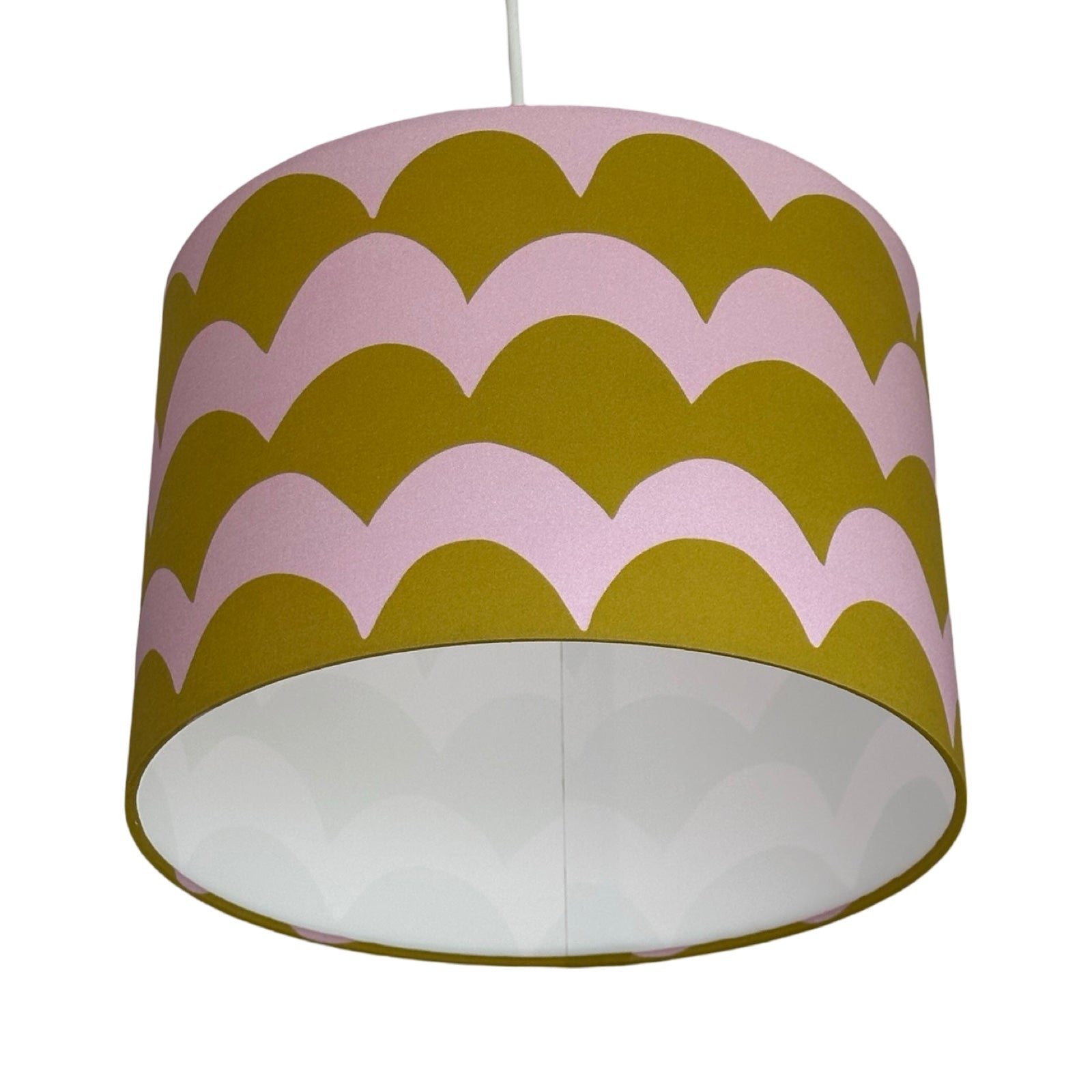 A drum lampshade in olive and lilac cotton with a wave design.