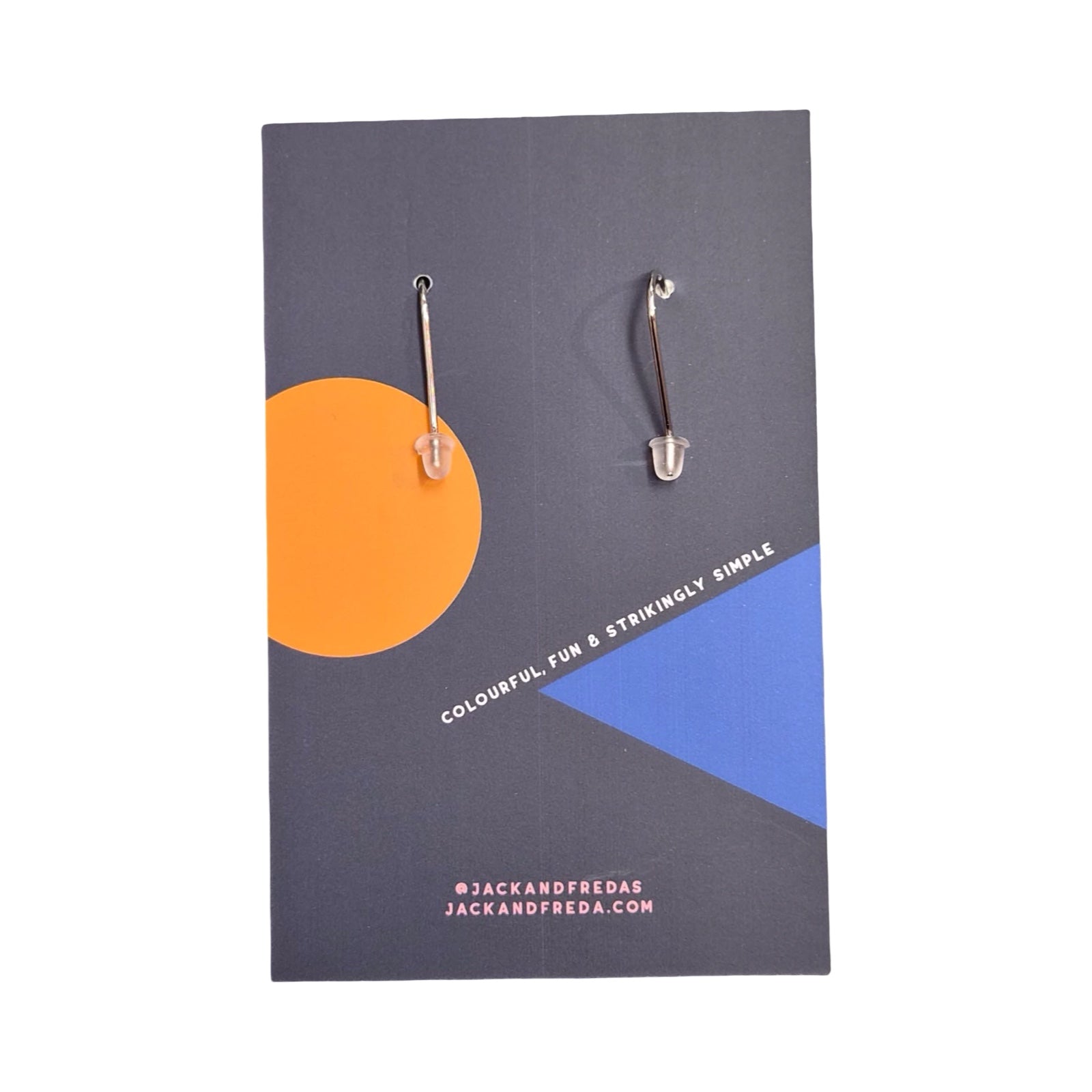 Back of a pair of earrings on a Jack and Freda branded card with geometric design.