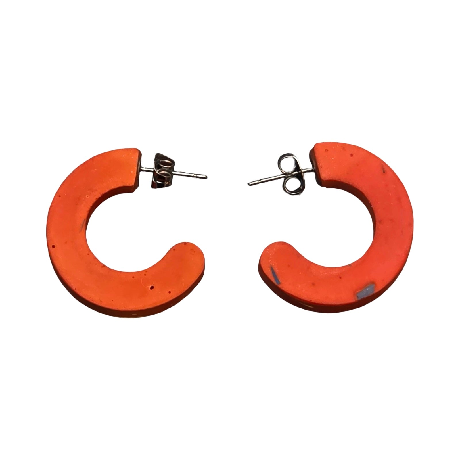 Orange chunky hoop earrings with red stripes.
