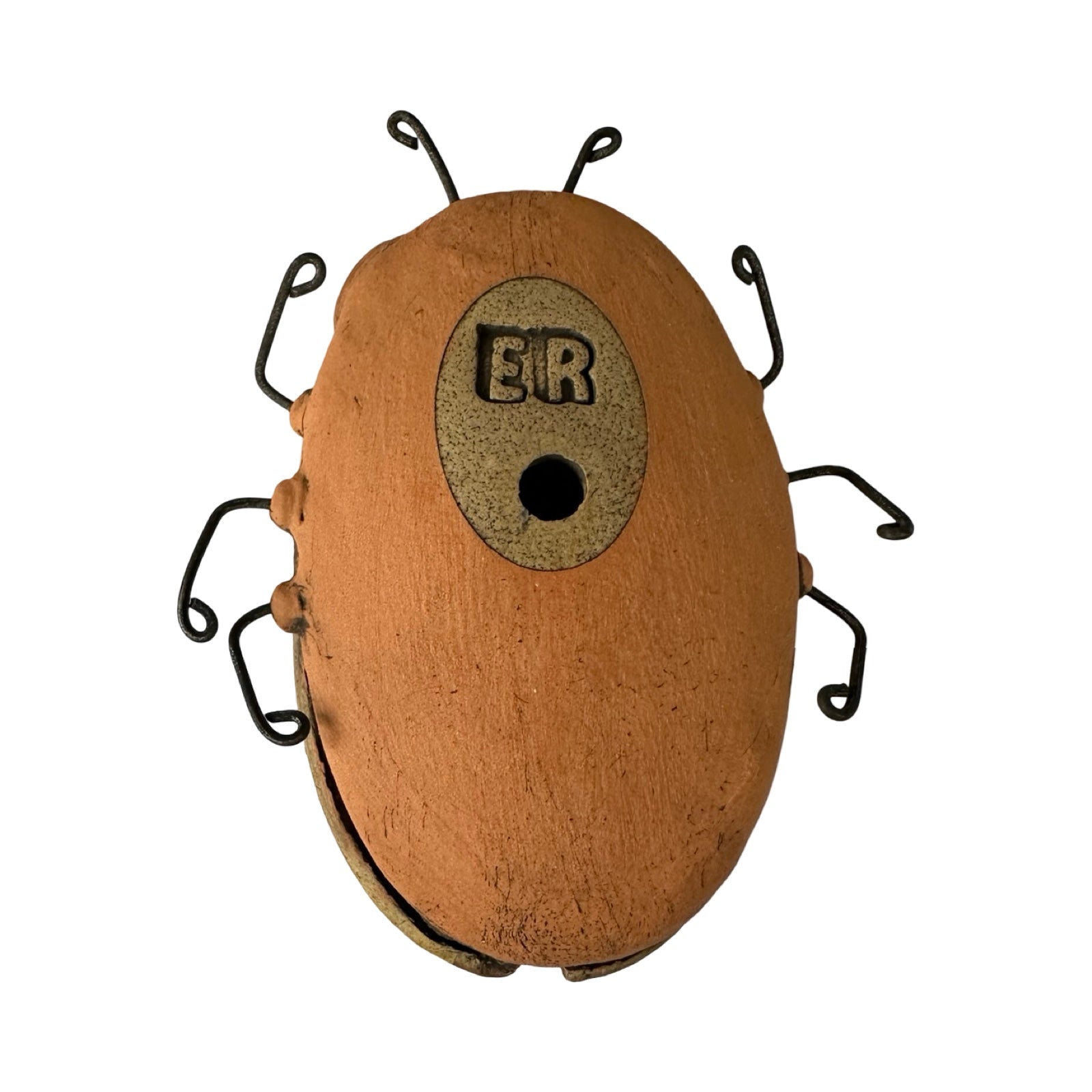 Back of ceramic beetle.