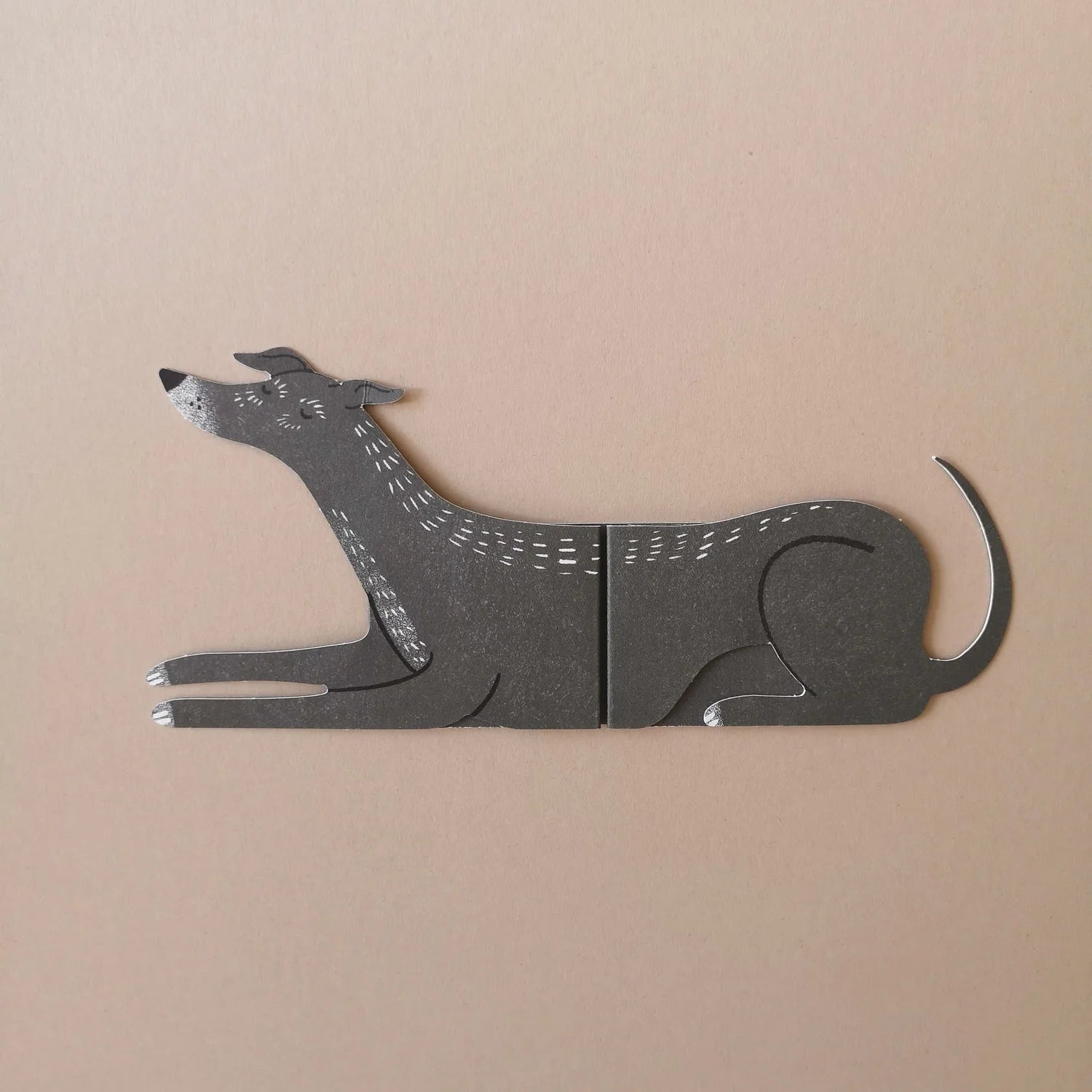 Card of a dog on a beige background.