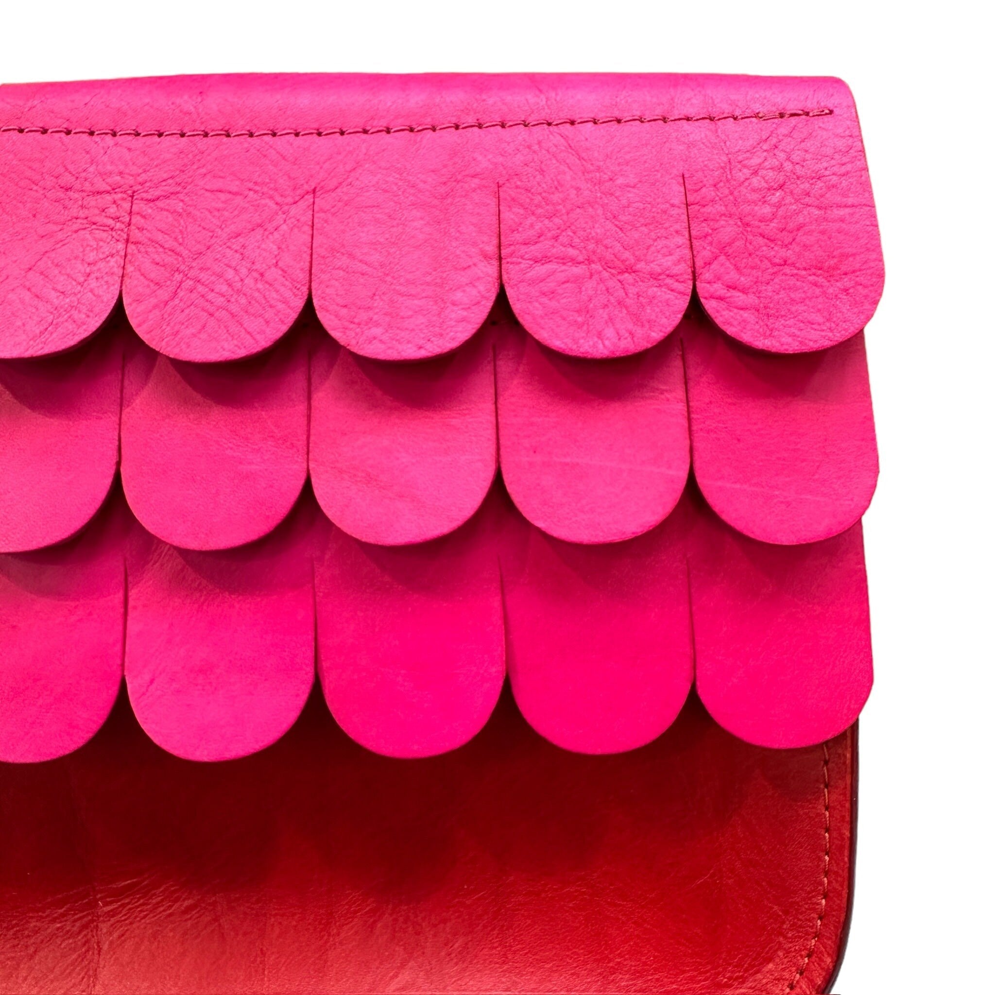 Leather satchels are made from hand dyed vegetable tanned leather, with contrasting textured wave flap which closes with a hidden magnetic clasp and has an adjustable strap.