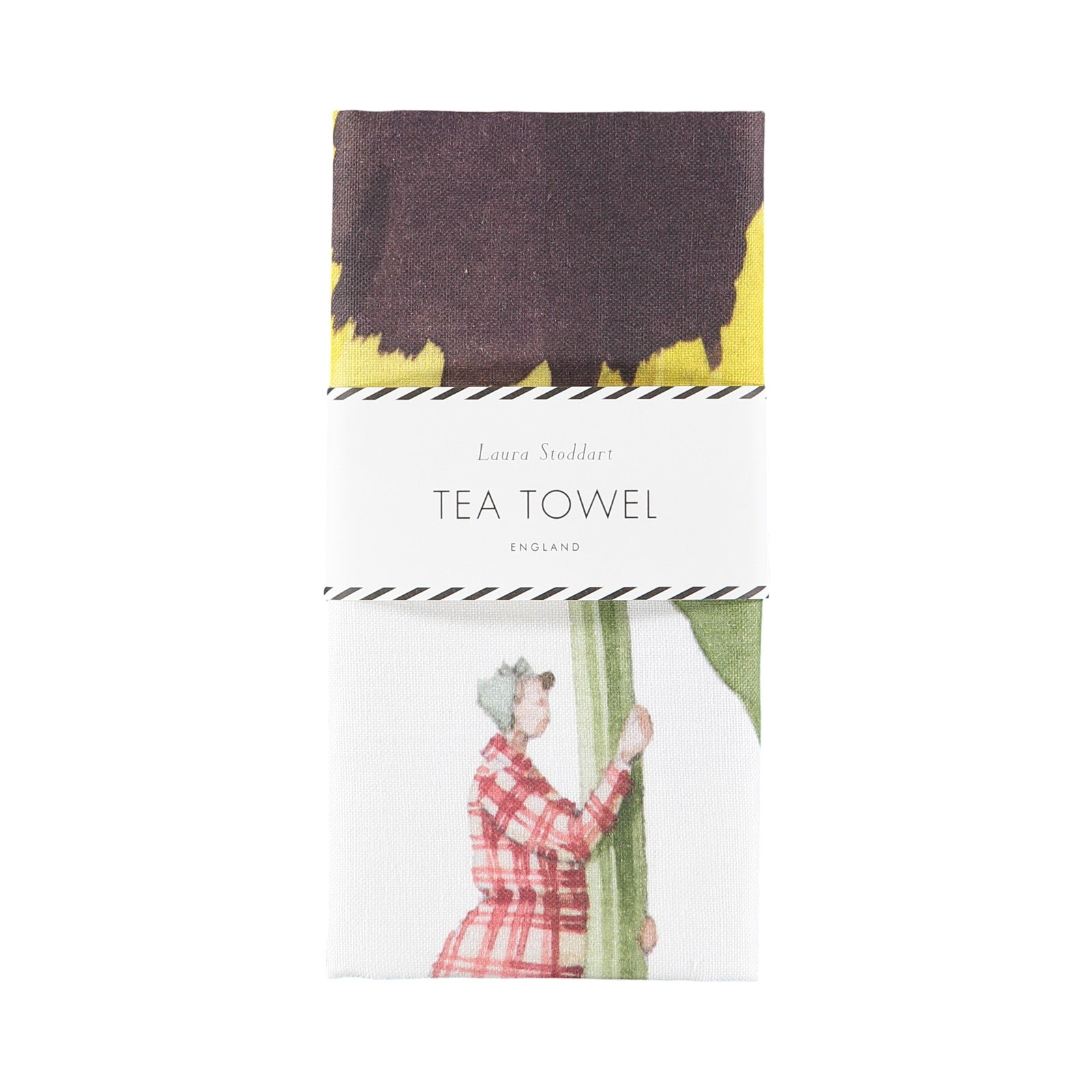 A folded floral tea towel featuring an illustration of a lady holding a giant yellow pansy.