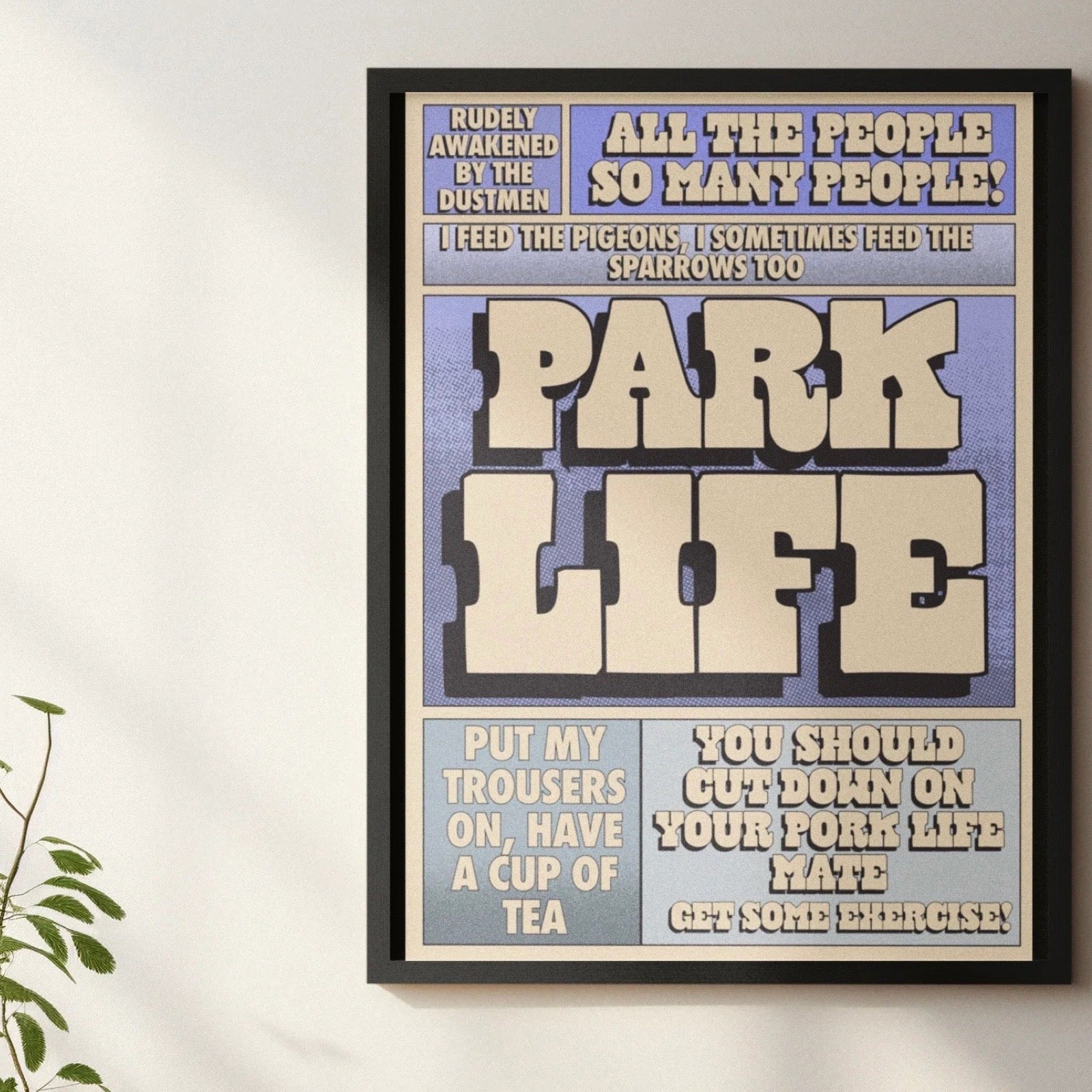 Framed poster with text on a white wall.