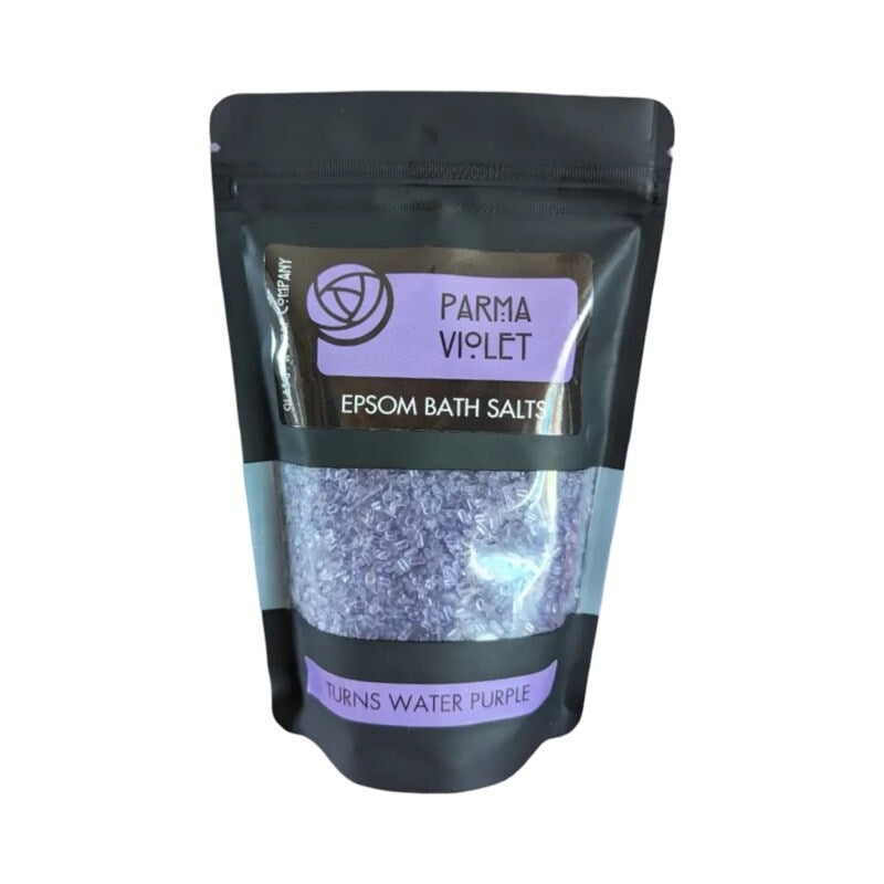 A black packet of parma violet epsom salts.