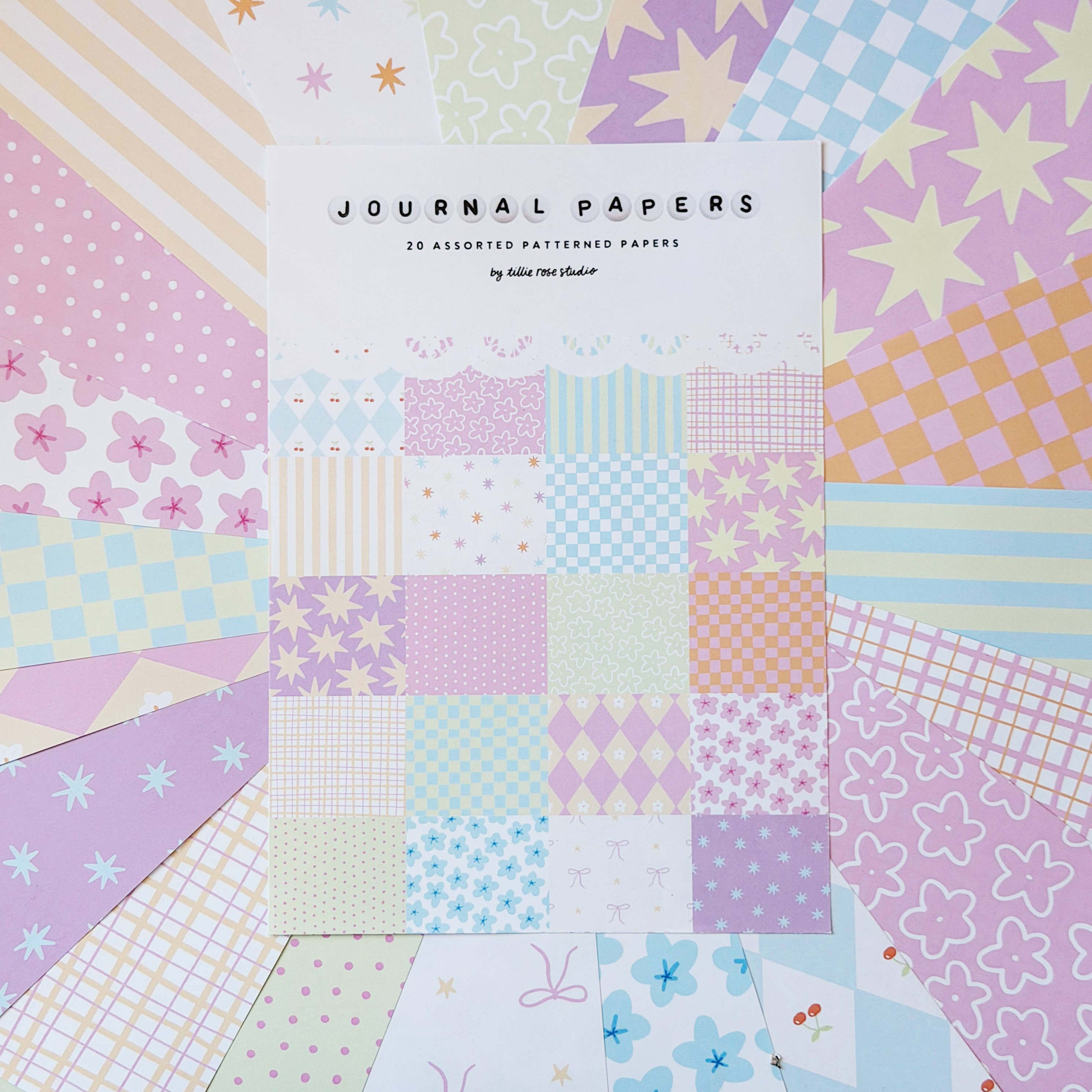 A sheet of patterned journal papers labeled 'JOURNAL PAPERS' by Tillie Rose Studio, on a colourful fanned pastel background.