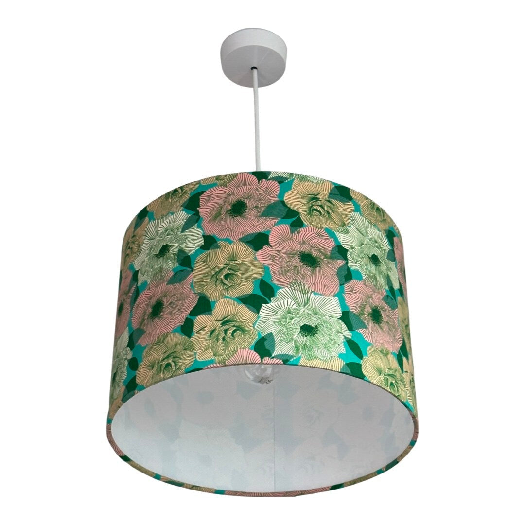 Drum lampshade featuring a green background with white, pink and cream roses