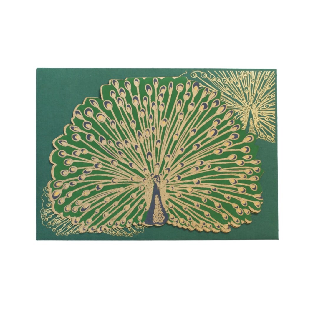 Green peacock-shaped card with gold detail and a green envelope.