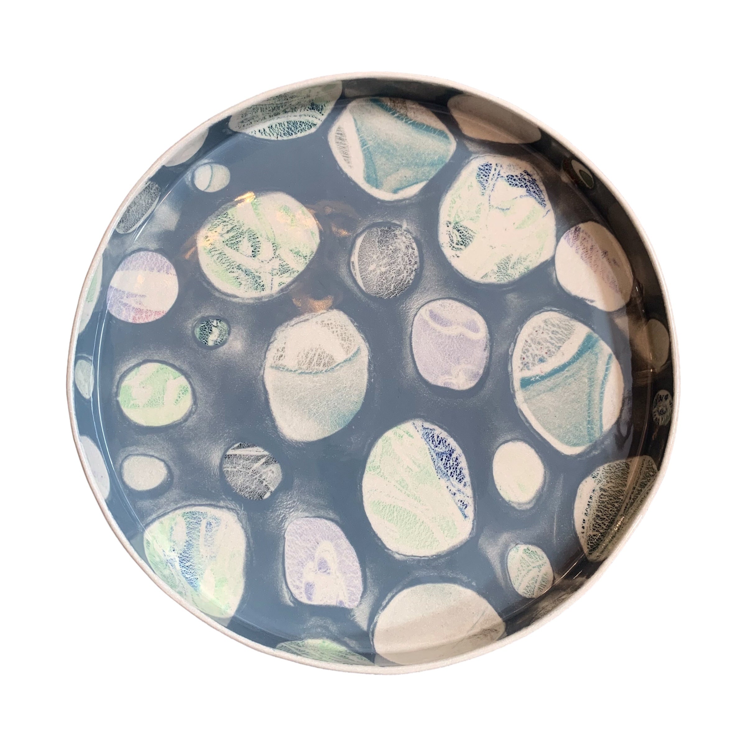 A ceramic platter in grey with a colourful pebbles design.