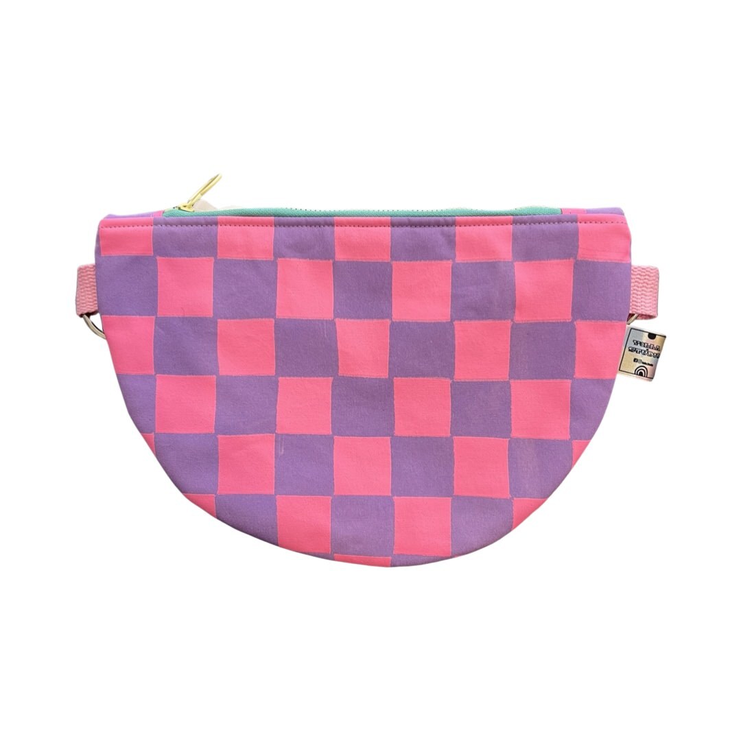 Pink and purple checked cross body bag.