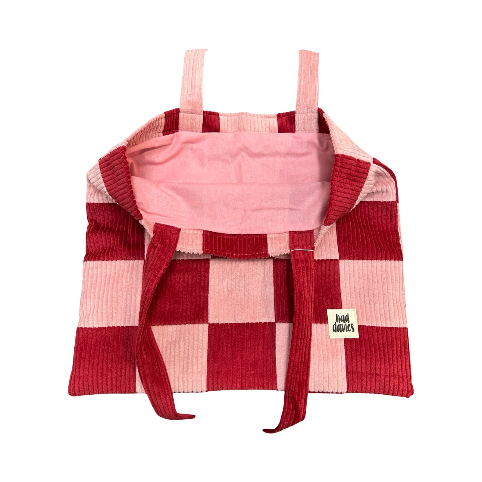 Red and pink checkered tote bag with a visible brand label on a white background