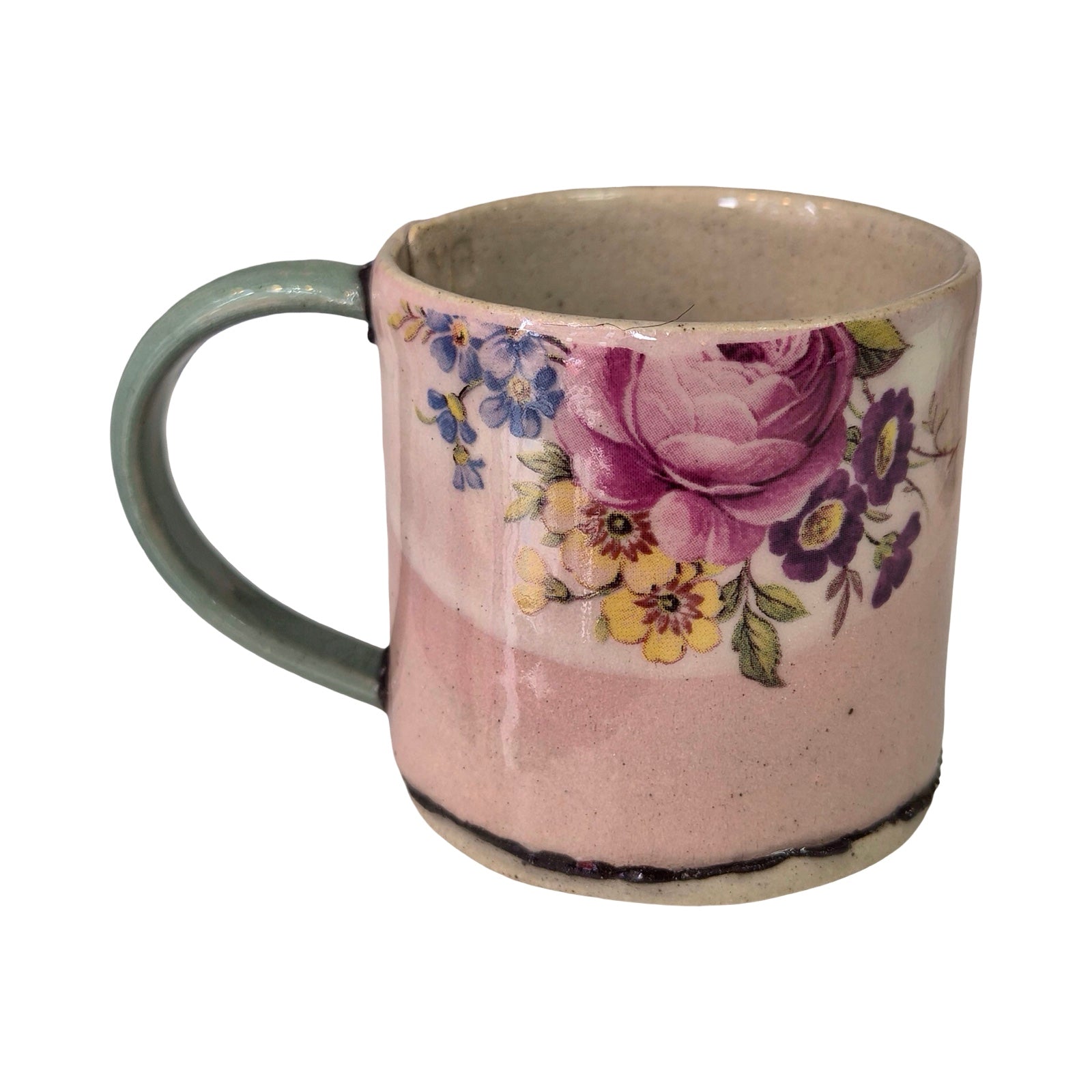 Ceramic mug with floral design on a white background.