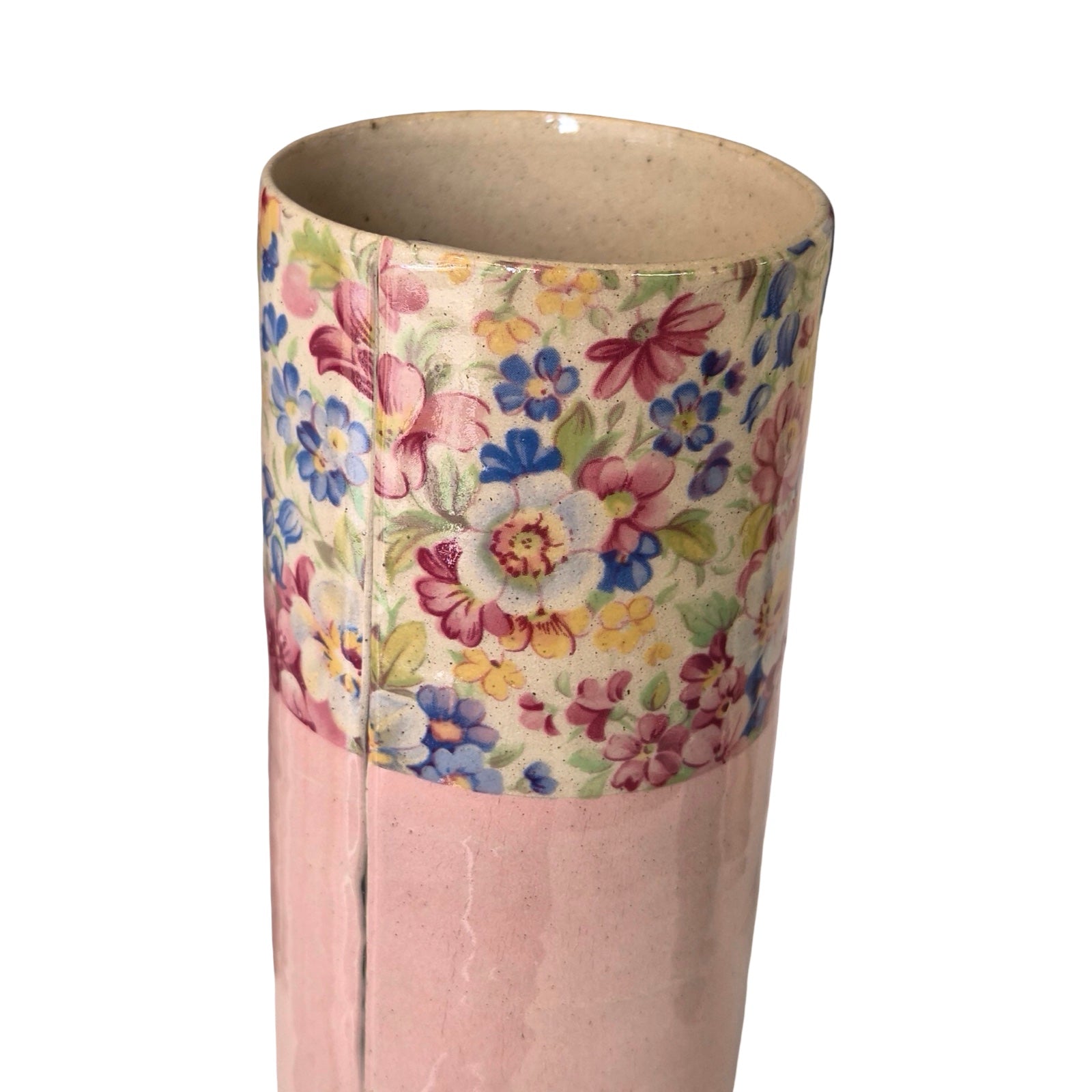 Cylindrical vase with floral pattern on a white background.