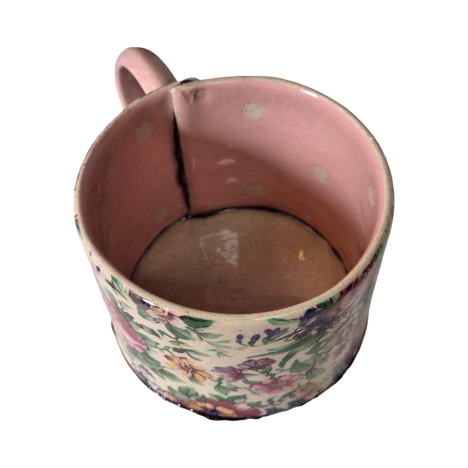 Ceramic mug with floral design on a white background.