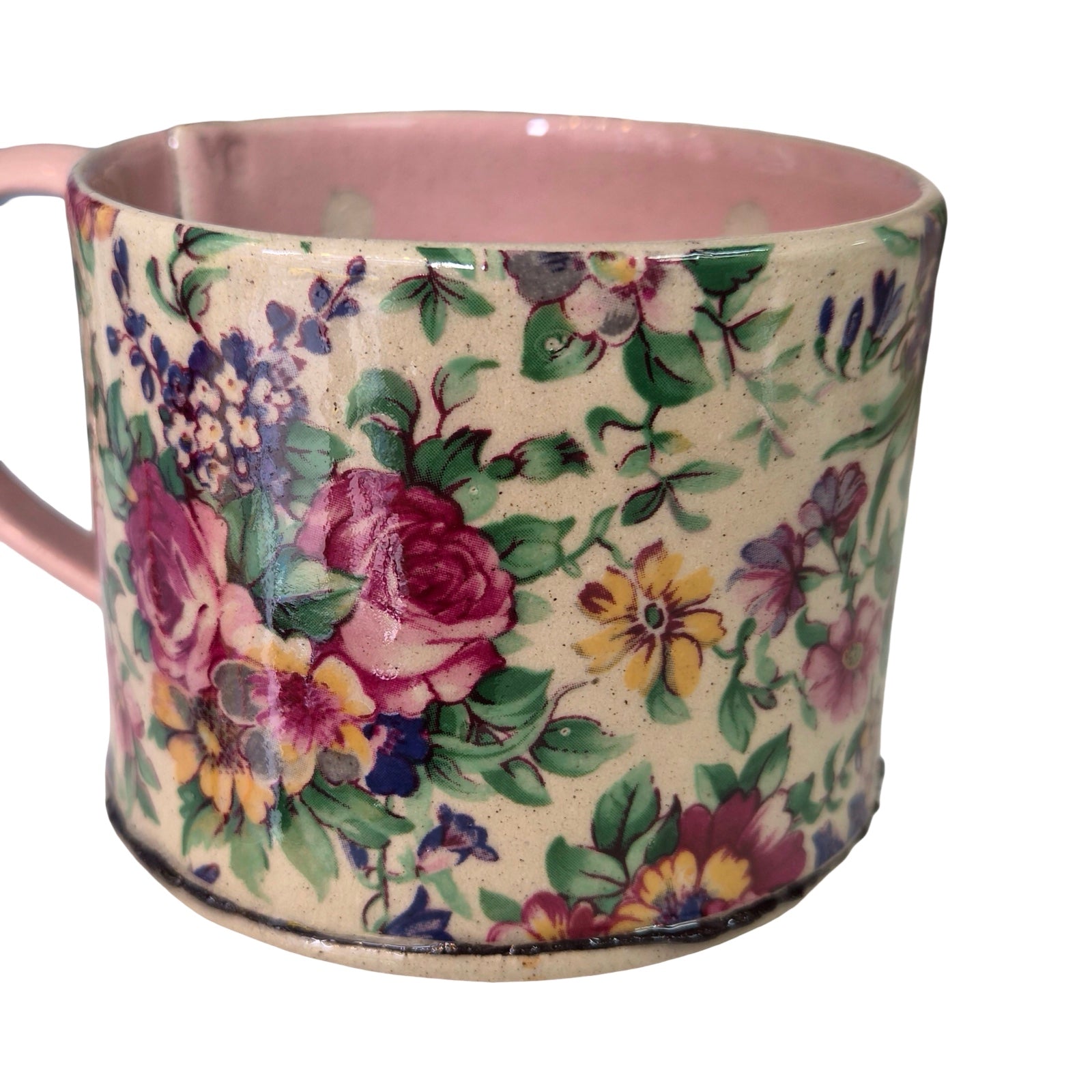 Floral-patterned mug on a white background.