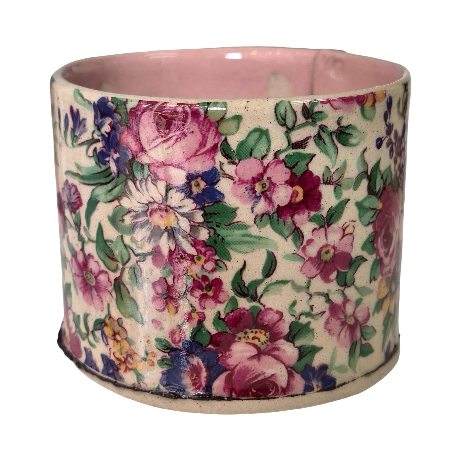 Floral-patterned mug on a white background.