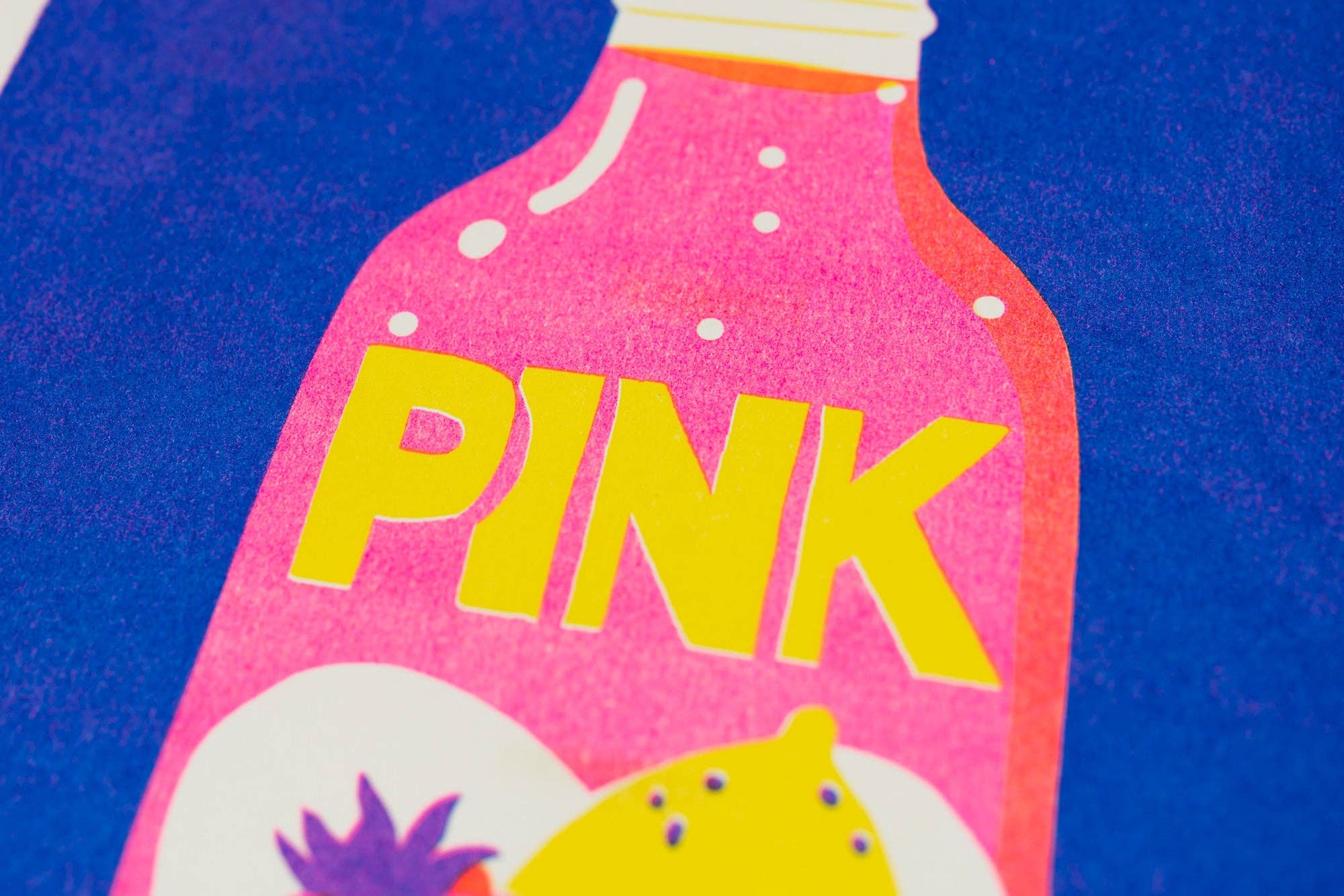 A close-up of a pink bottle-shaped graphic with the word 'PINK' in large yellow letters, set against a textured blue background.