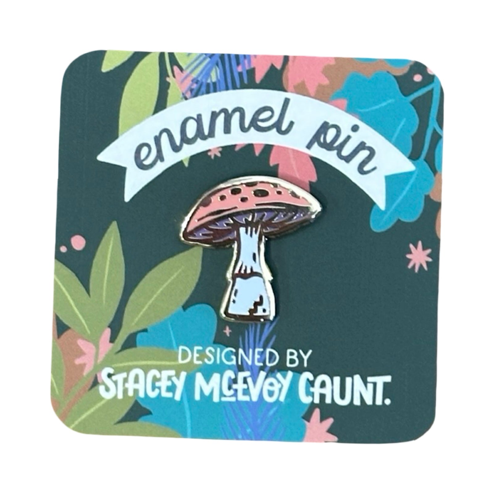 A pink mushroom-shaped enamel pin badge with a white stalk.