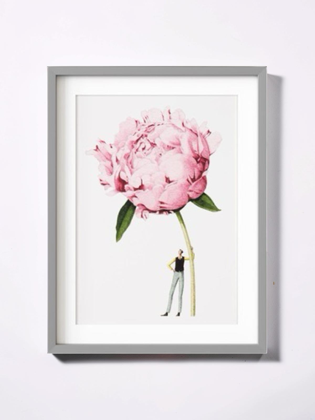 Framed artwork of a pink peony flower with a small figure underneath on a white background.