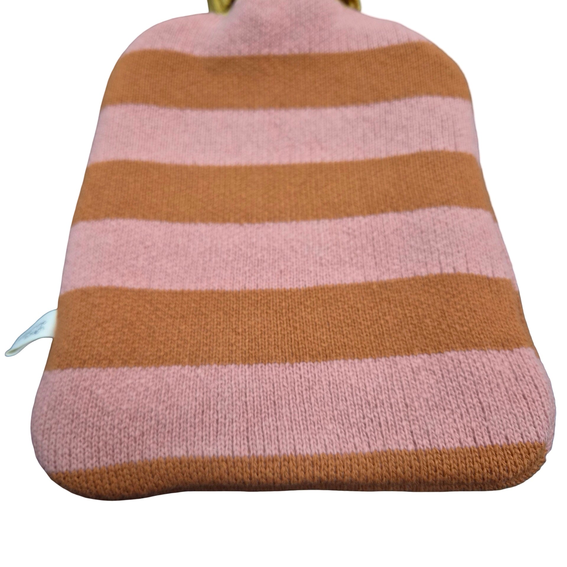 A knitted hot water bottle cover with horizontal stripes in dusty pink and warm orange, shown against a plain white background.