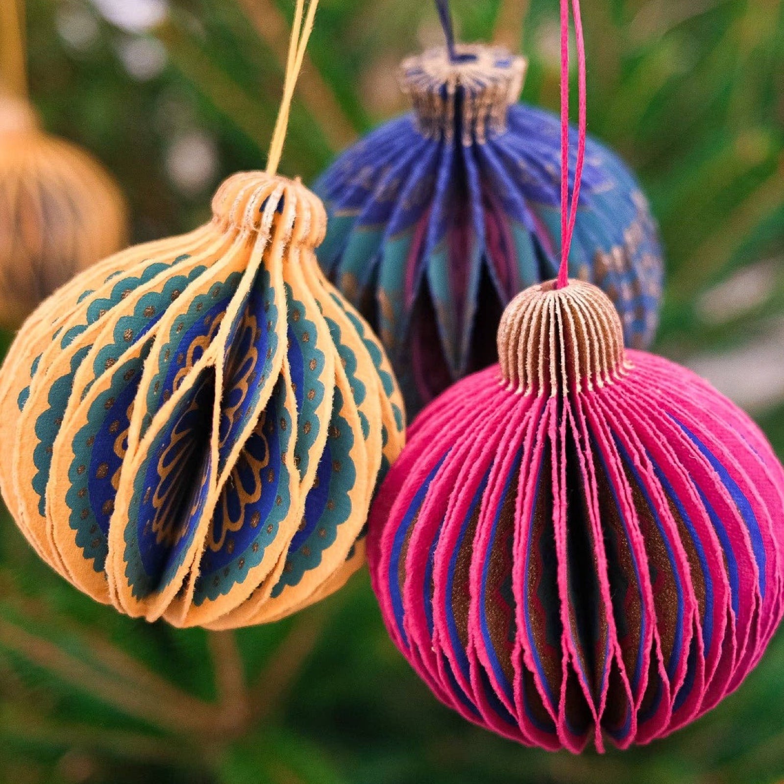 These gorgeous yellow and green honeycomb Christmas baubles are made from recycled cotton paper.