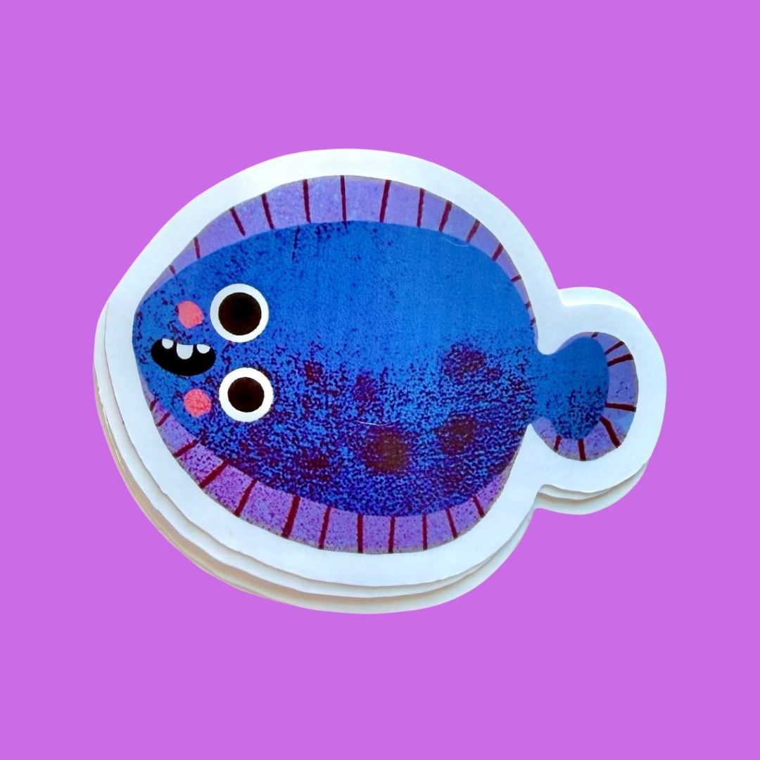 A stack of die-cut stickers shaped like a cartoon blue fish with a white border, shown on a solid purple background.