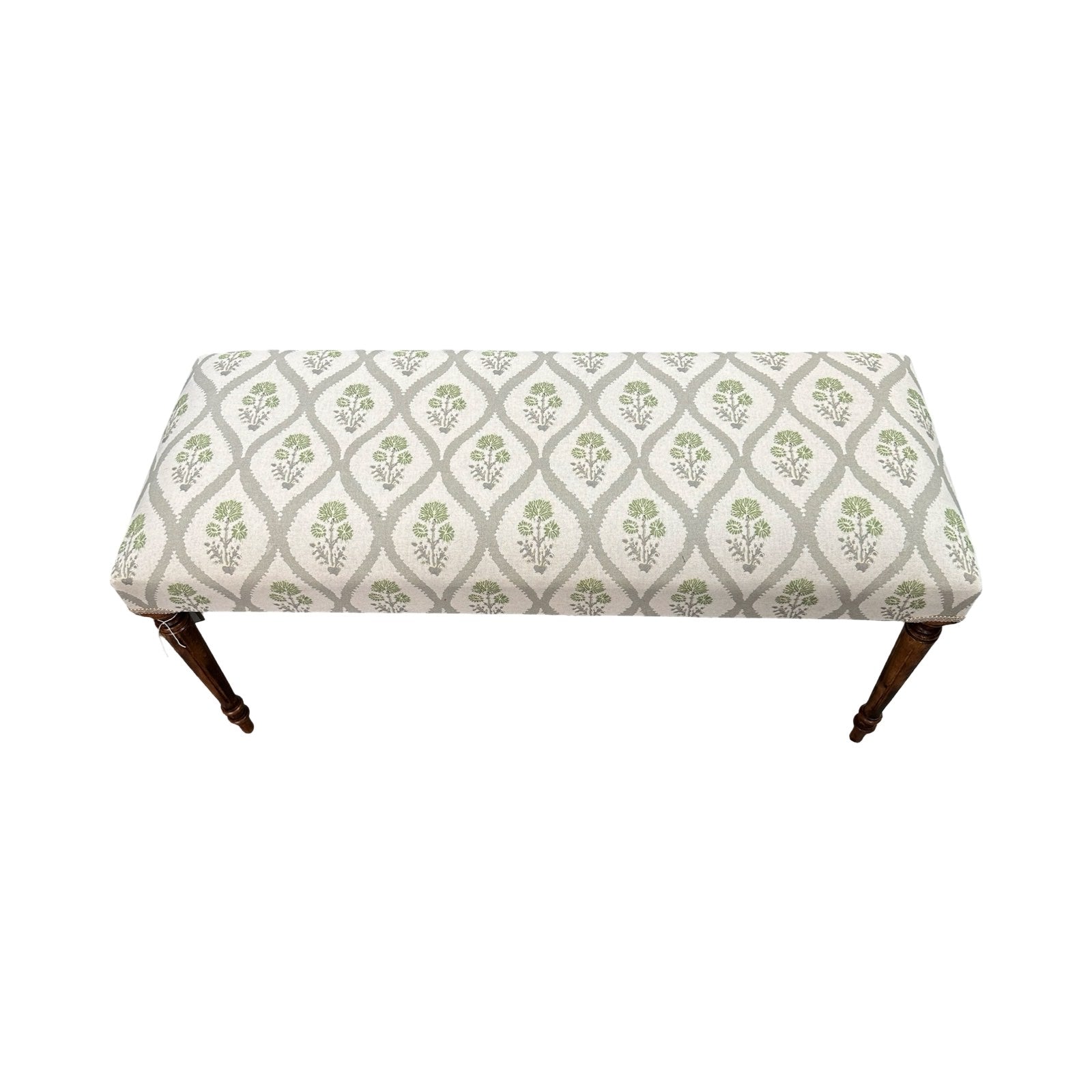 Patterned bench with wooden legs on a white background.