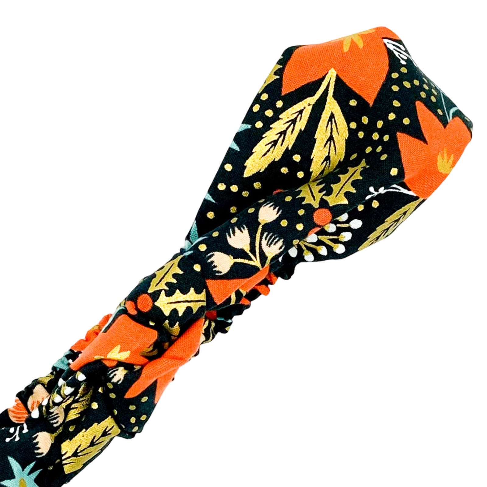 Handmade poinsettia patterned, floral and festive top knotted Alice band.
