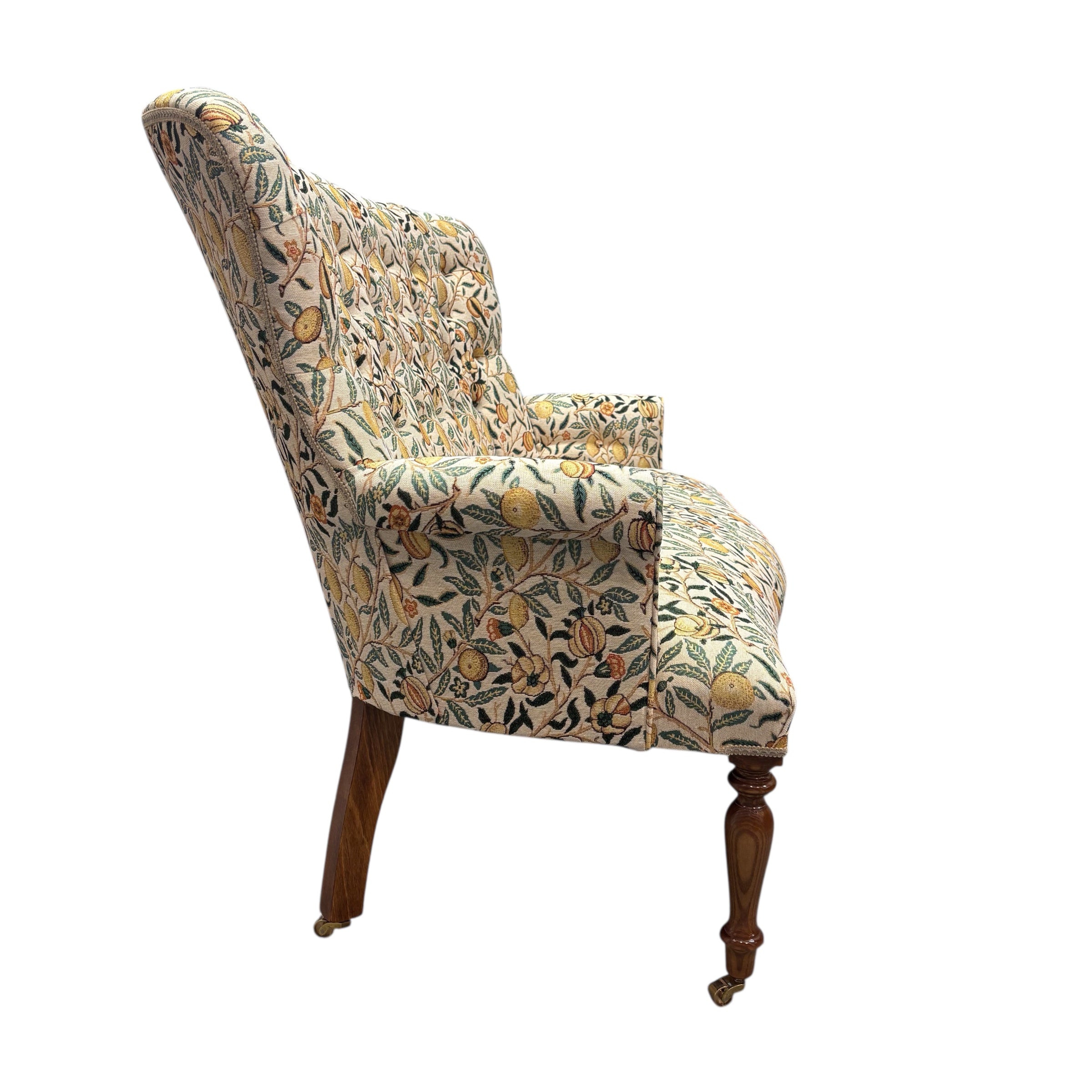 A beautiful hand-crafted occasional two-seater sofa with a high button back covered in gorgeous fabulous woven William Morris style pomegranate fruits fabric in cream with yellow fruit.
