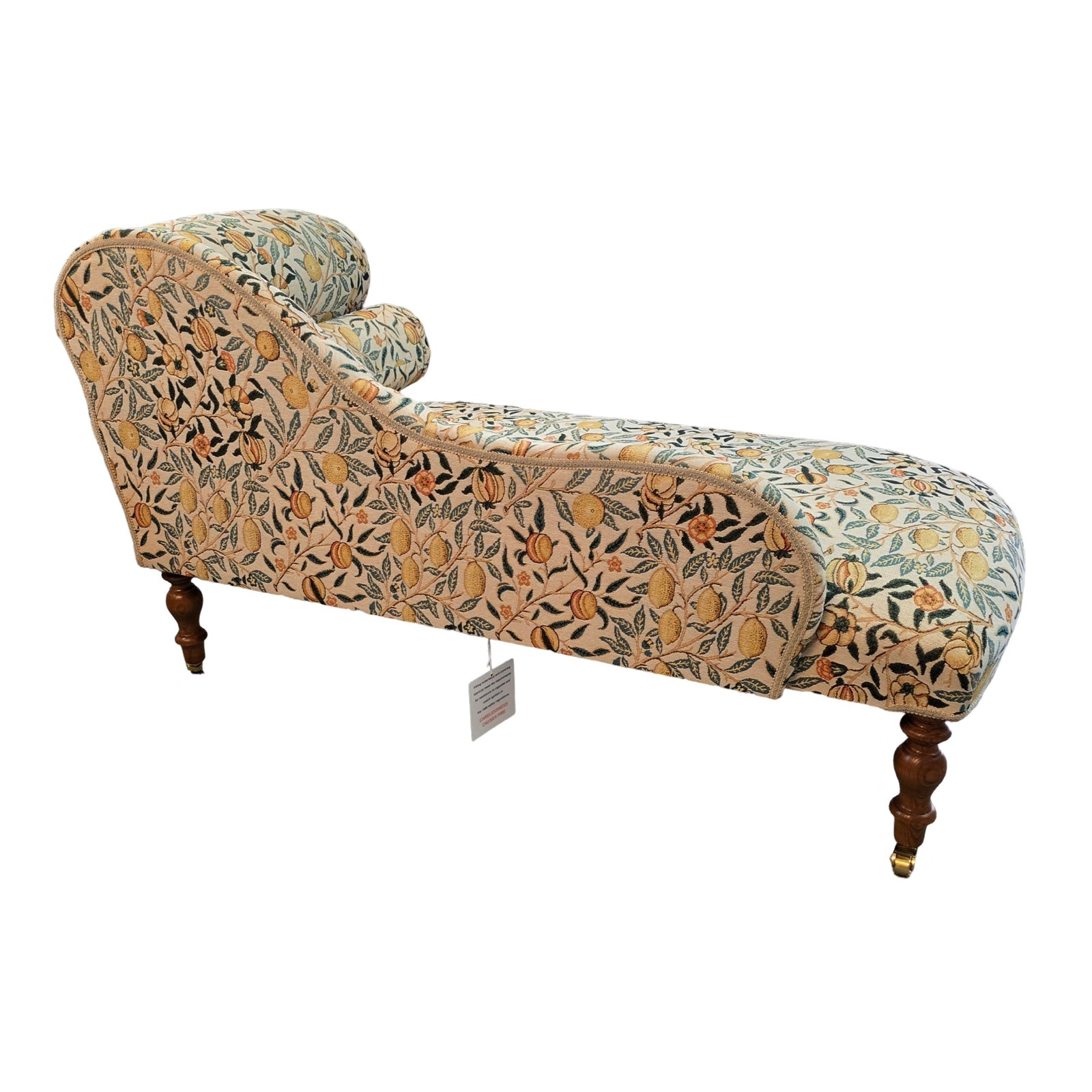 The back of a handcrafted chaise longue in fabulous woven William Morris style pomegranate fruits fabric in cream with yellow fruit.