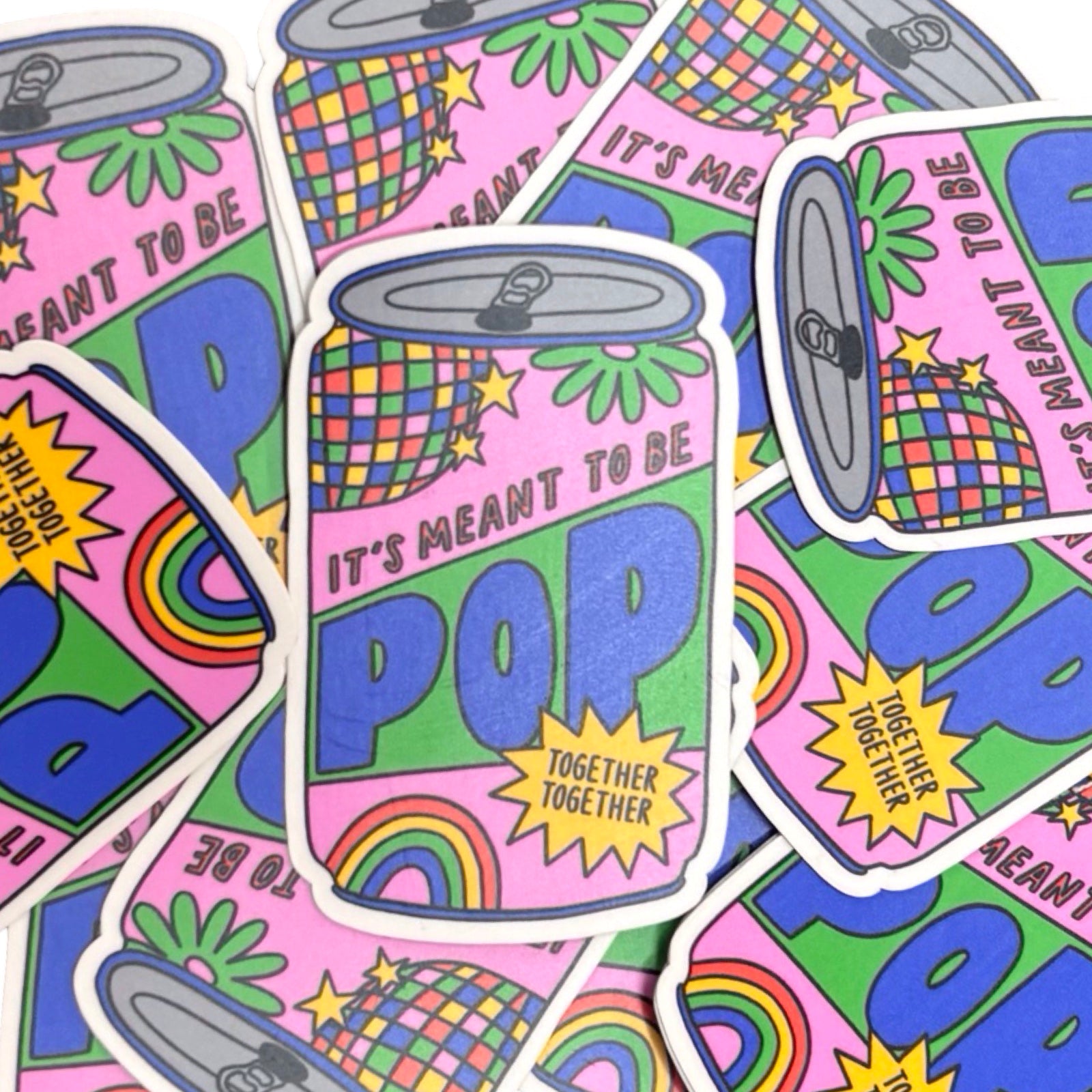 Colourful 'It's Meant to Be Pop' can design with rainbow elements on a pink background.