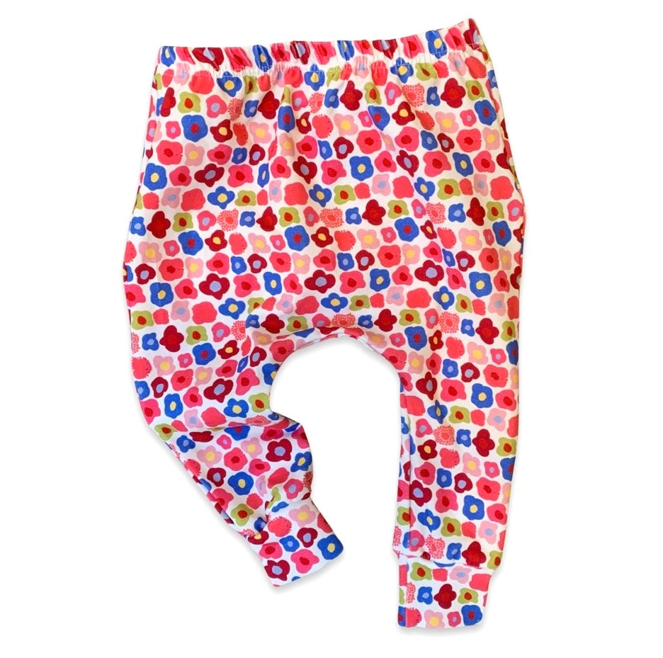 Colorful floral baby harem leggings with a stiff waist elastic and cuffs.