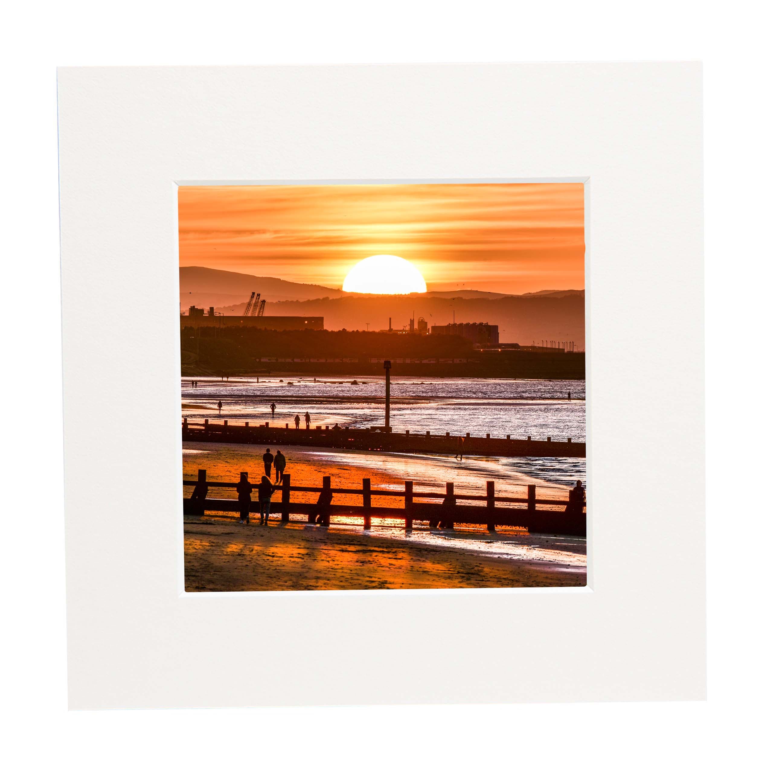 An image of the sunset taken from Portobello Beach in a mount.