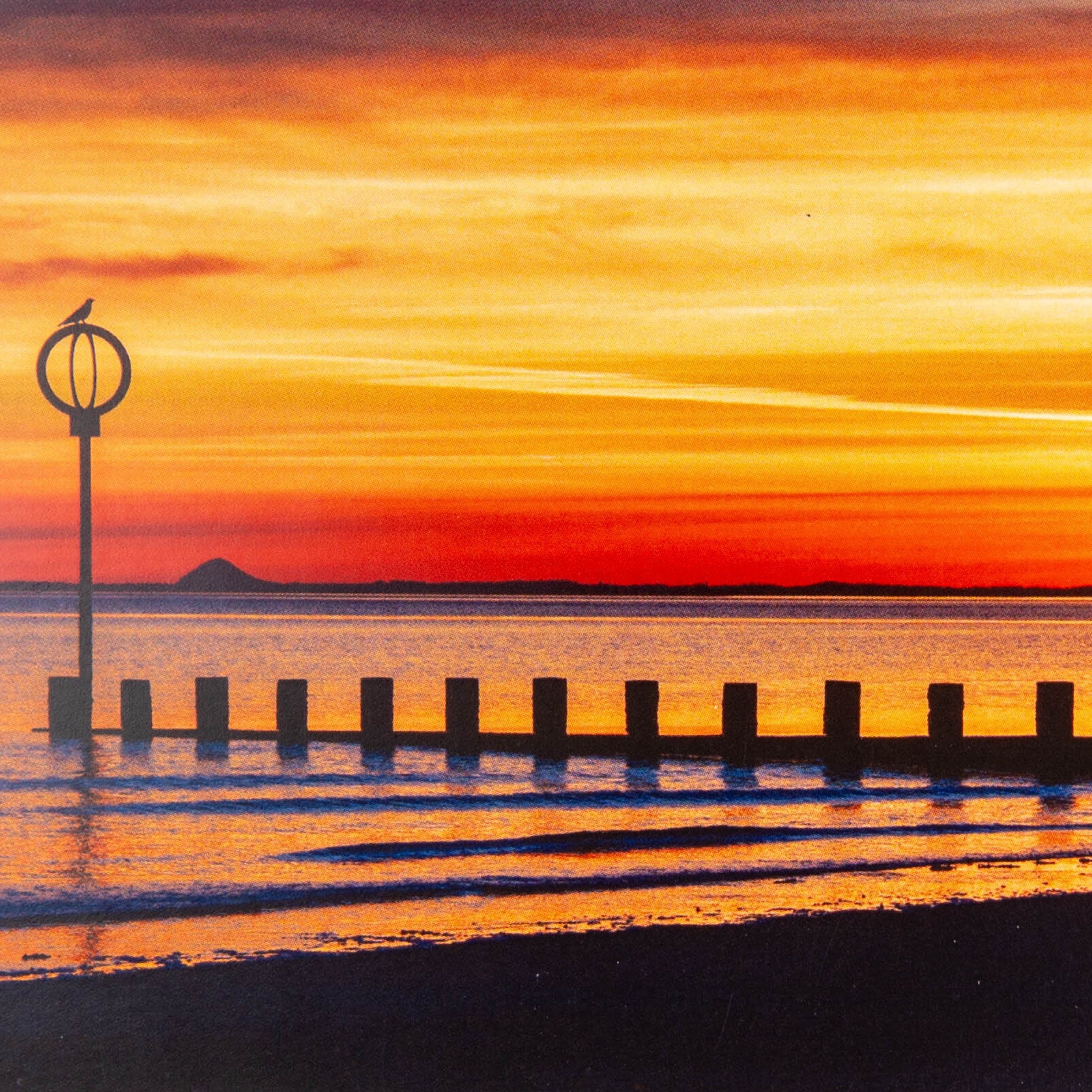 A greeting card depicting a sunset at Portobello Beach.