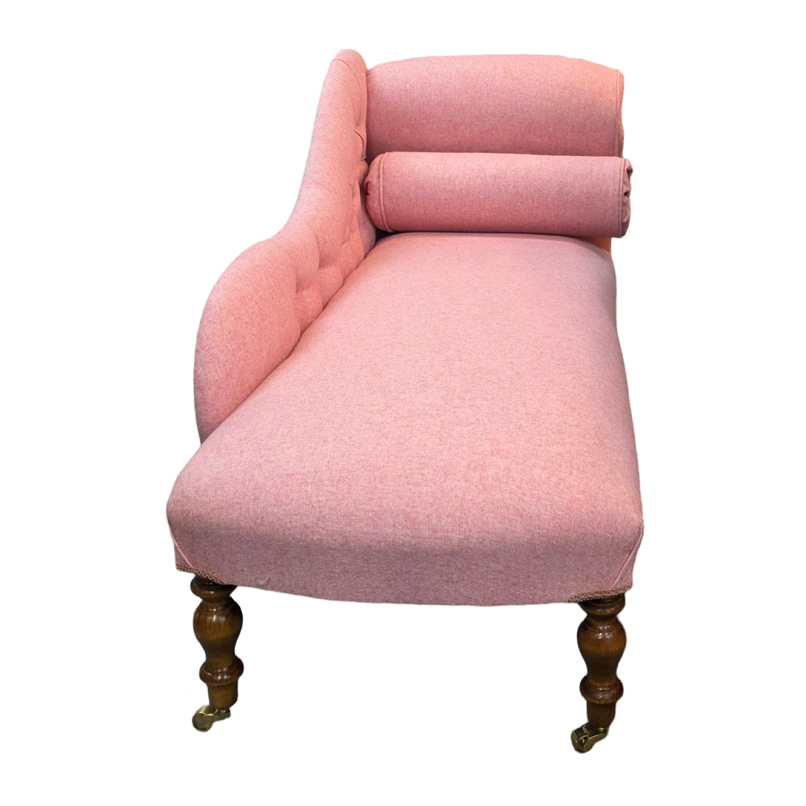 A handcrafted chaise lounge in gorgeous powder pink wool mix fabric.