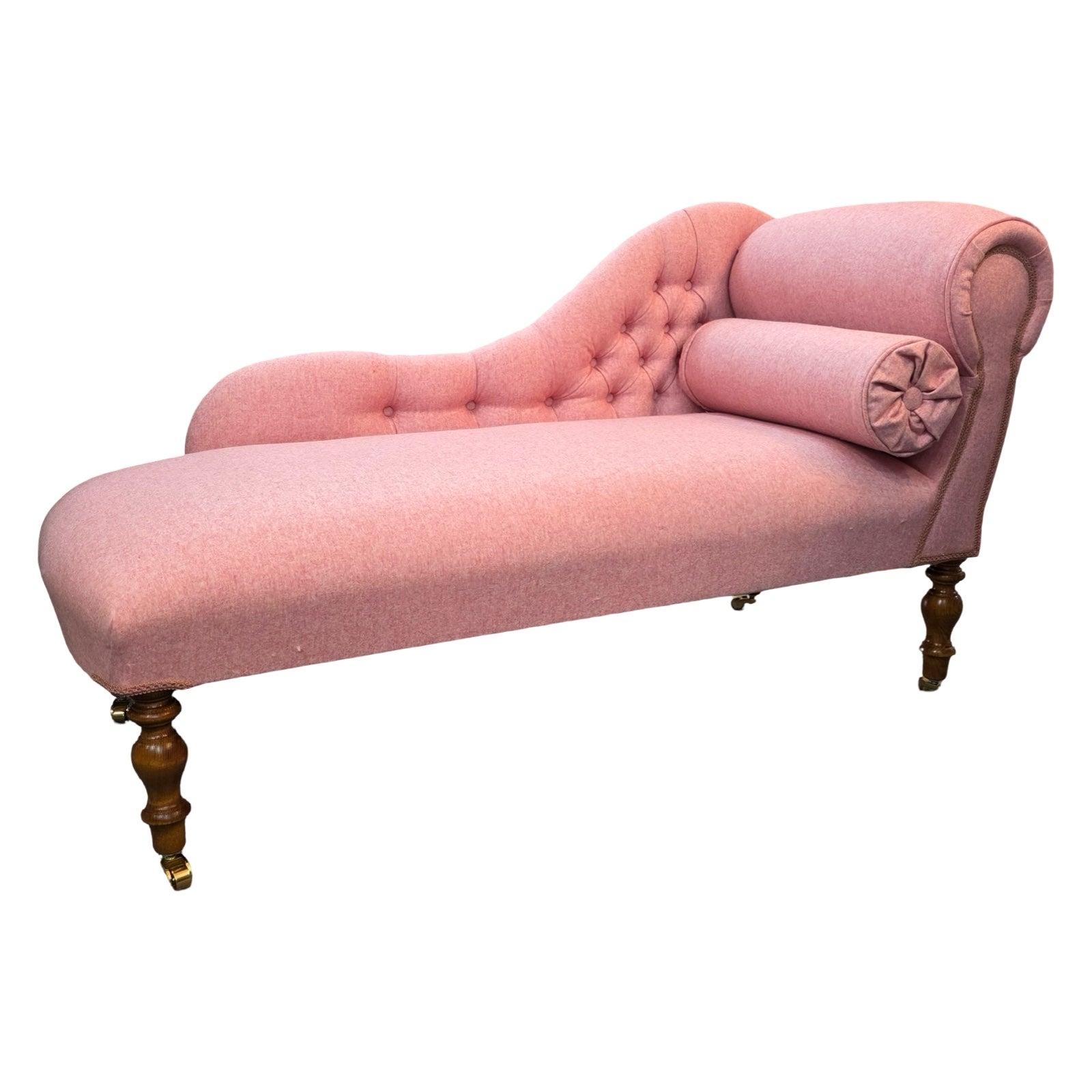 A handcrafted chaise lounge in gorgeous powder pink wool mix fabric.