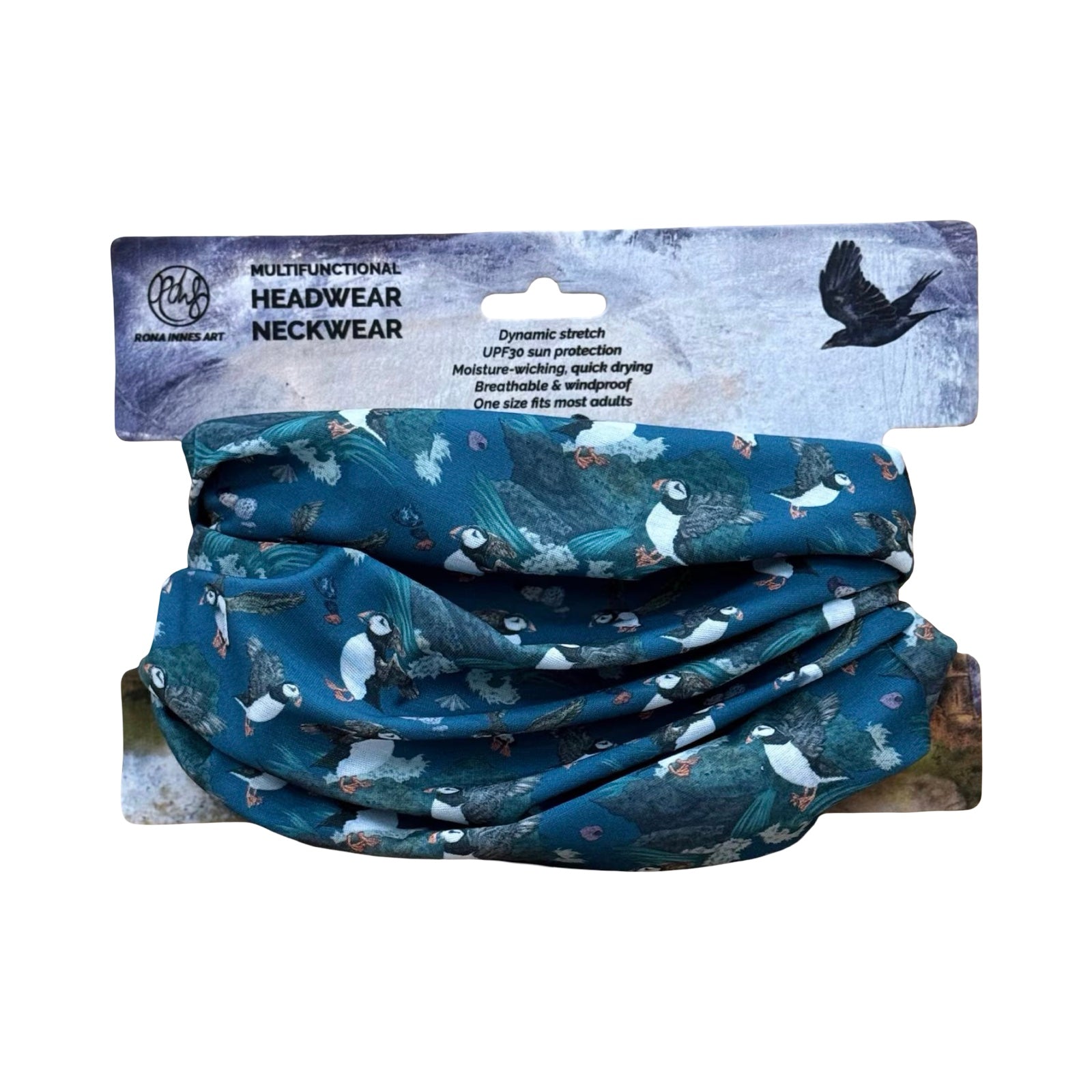 A dark blue neck warmer featuring illustrations of flying puffins.