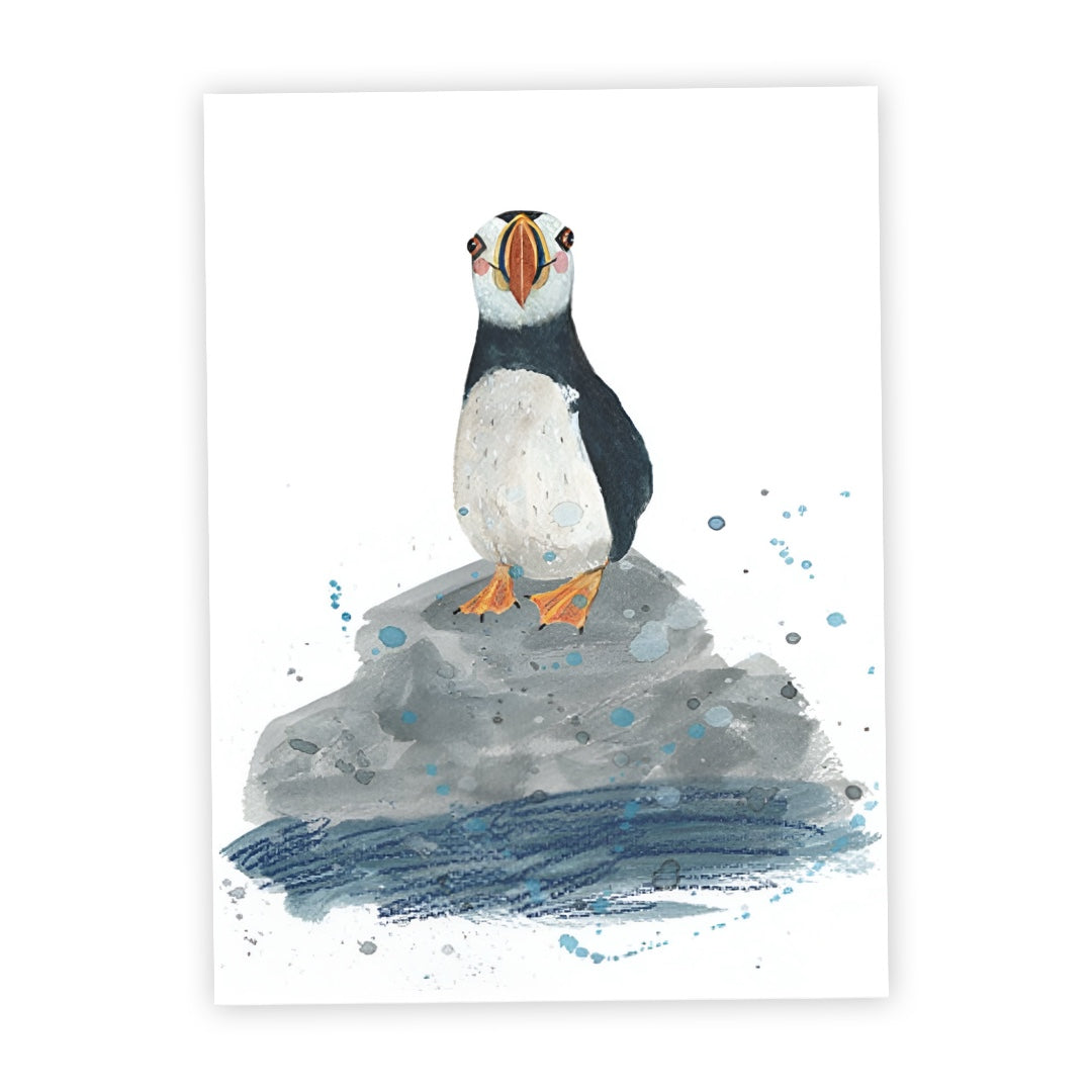 This print features a standing puffin perched on a rock in the sea, against a white background.