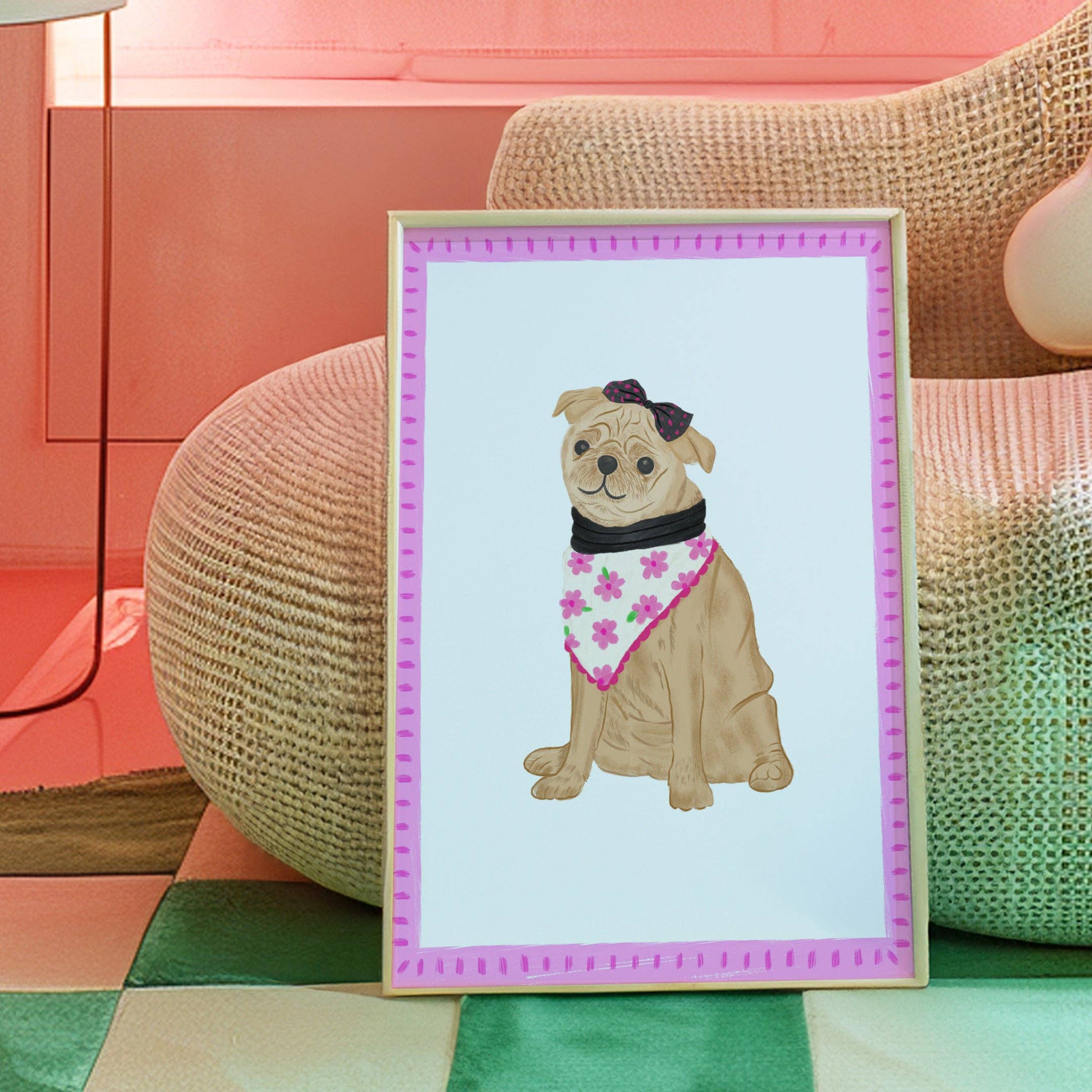 Framed illustration of a dog with a bandana on a colourful background, resting on a sofa.