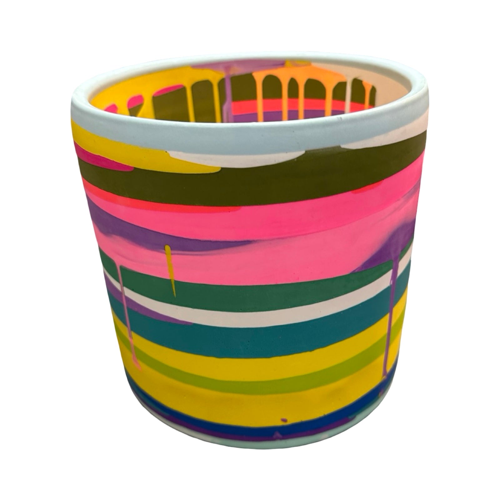 Colourful striped planter on a white background.