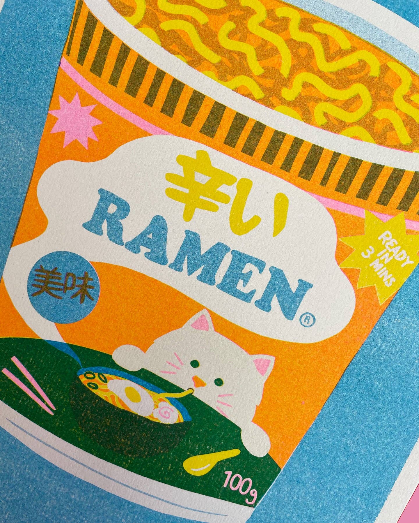 This colourful risograph print features a tub of ramen noodles against a blue background.
