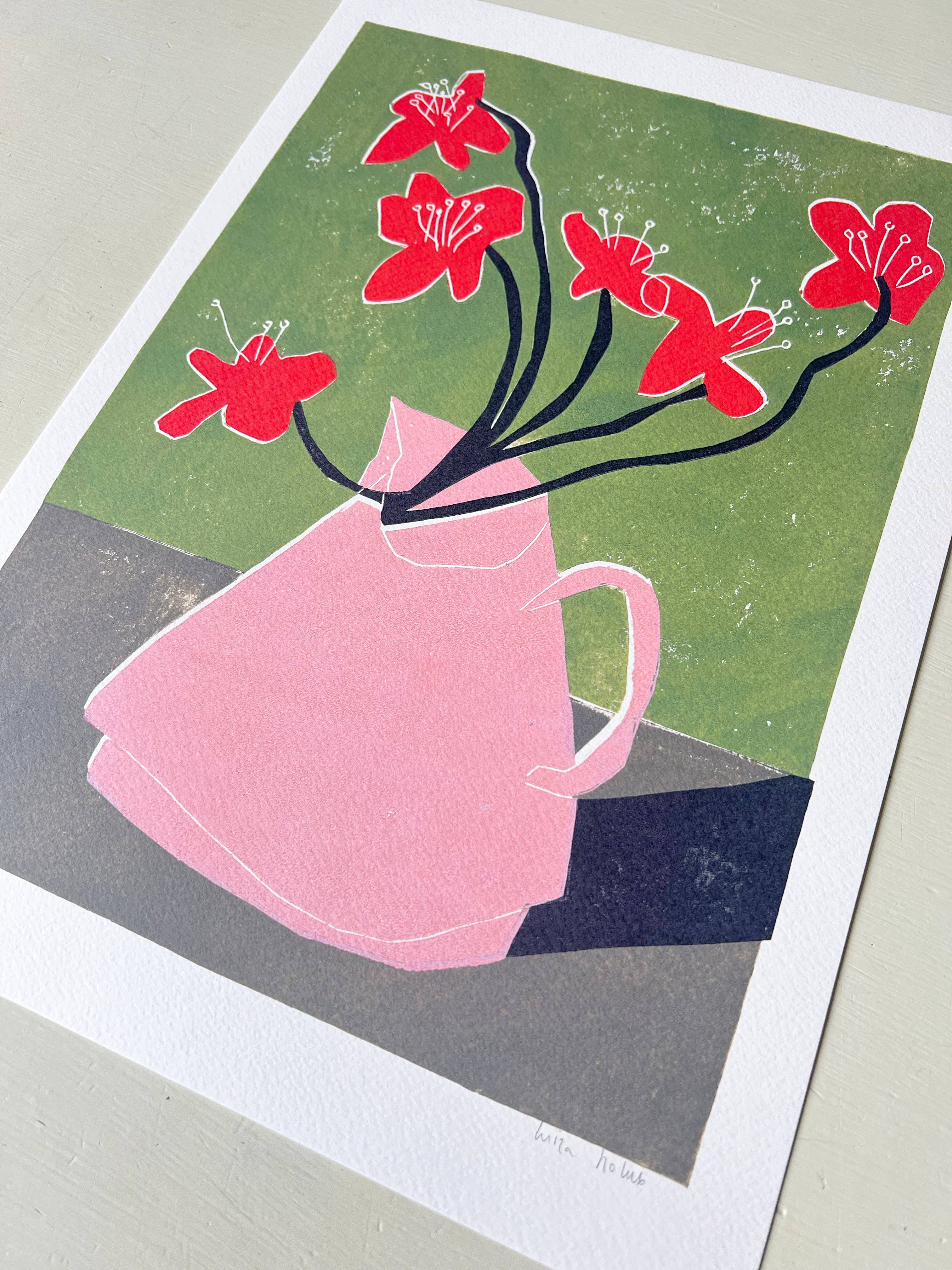 Illustration of a pink teapot with red flowers on a green background.