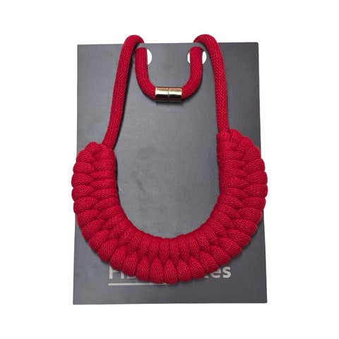 A hand-knotted style necklace made by hand from 100% recycled red cotton cord with a magnetic metal fastening.