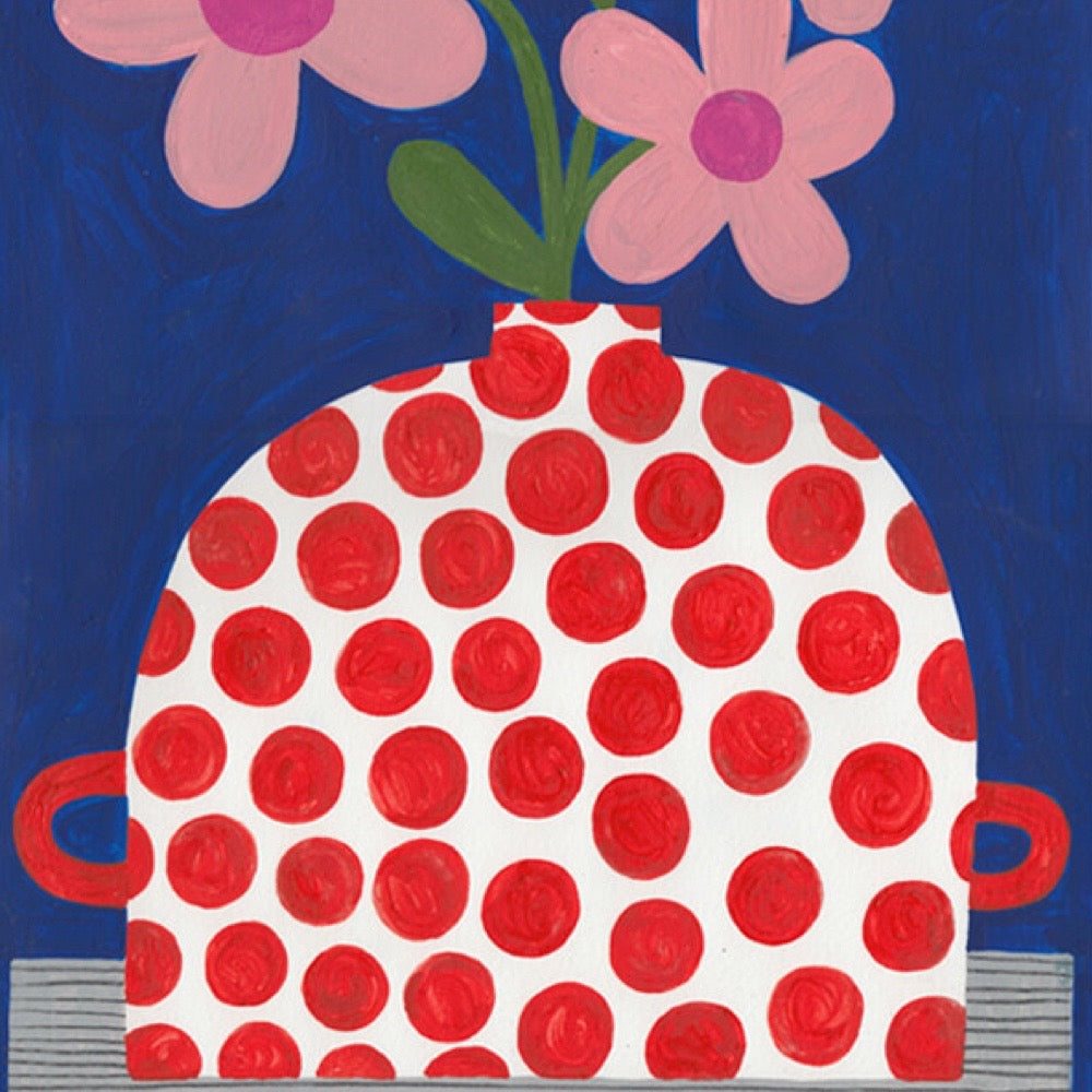 Red polka dot vase with pink flowers on a blue background.