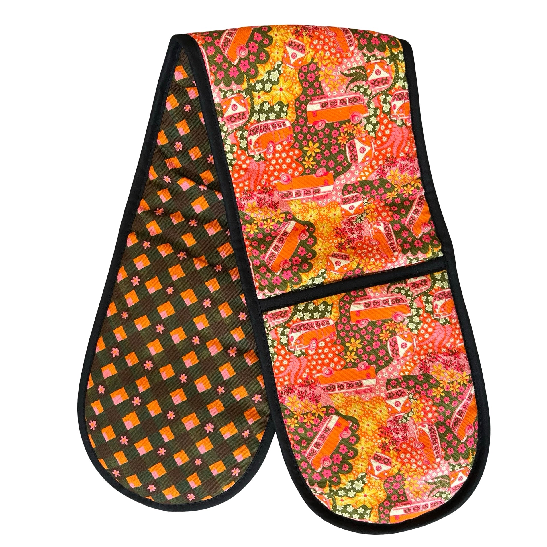 Oven gloves with a repeat pattern illustration of an orange and cream VW campervan against a floral backdrop on the front and a checked pink, orange, green and black patterned reverse.