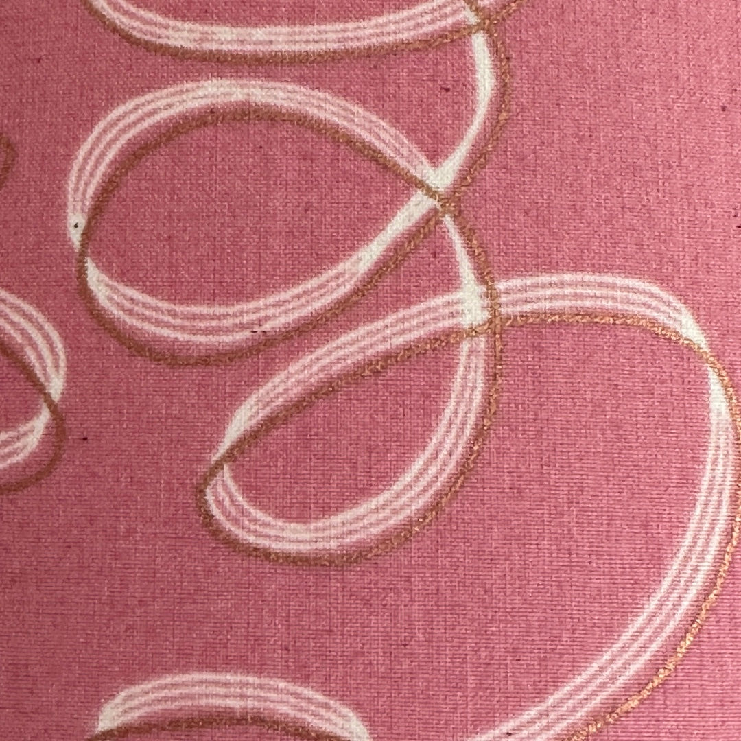 Pink cotton fabric with white and gold ribbons