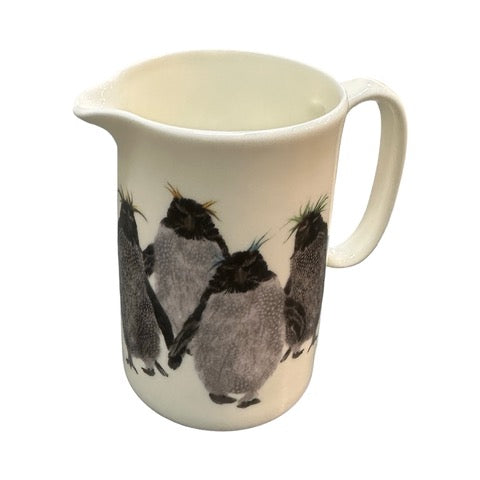 White fine-bone china milk jug featuring an illustration of a waddle of rockhopper penguins.