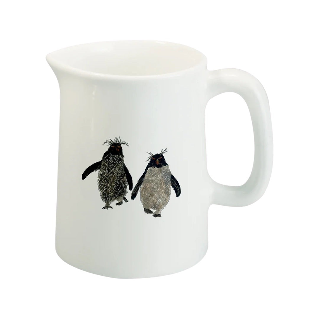 White fine-bone china milk jug featuring an illustration of two rockhopper penguins.