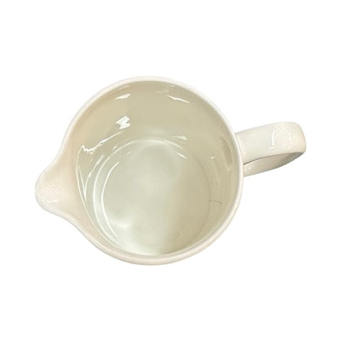 White fine-bone china milk jug featuring an illustration of a waddle of rockhopper penguins.